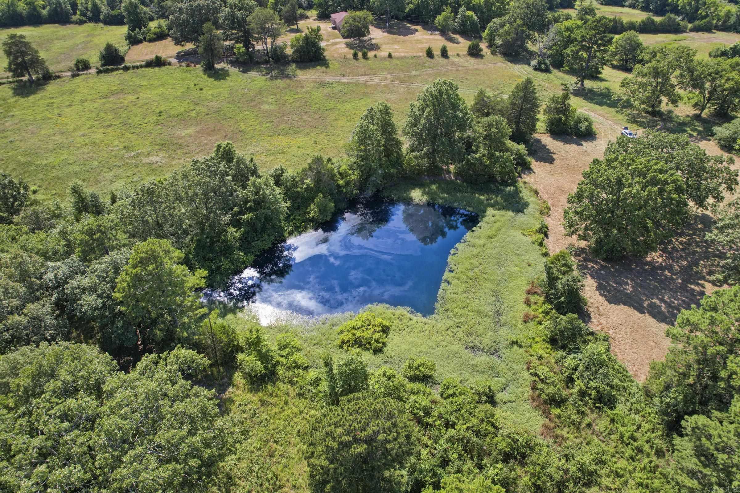 Looking for the perfect spot to get away, explore, and build your dream getaway in the small warm & welcoming town of Mena, Arkansas situated within the Ouachita mountains and National Forest!  This private, yet, easily accessible property offers the perfect blend of seclusion and convenience, just a short few minute drive from town. With breathtaking mountain views all around, multiple stunning building sites, and a peaceful pond, this land is an ATV & outdoor enthusiast's dream paradise! ATV’s can easily be ridden to trails!  The property features a mix of wooded areas and open spots, providing both shade and plenty of room to roam. You'll find an abundance of wildlife to enjoy, plus the freedom to ride your ATV’s directly from the property a few miles to the nearby Wolf pen trails, creeks, and the Ouachita River. The 1.8 million acres of Ouachita National Forest is just a stone’s throw away, offering endless adventure and exploration. Electricity is already available on-site! . Need more space? An additional 40-acre parcel borders this property, offering even more room for your mountain retreat. This land has it all—privacy, access, views, wildlife, and adventure—don’t miss out!
