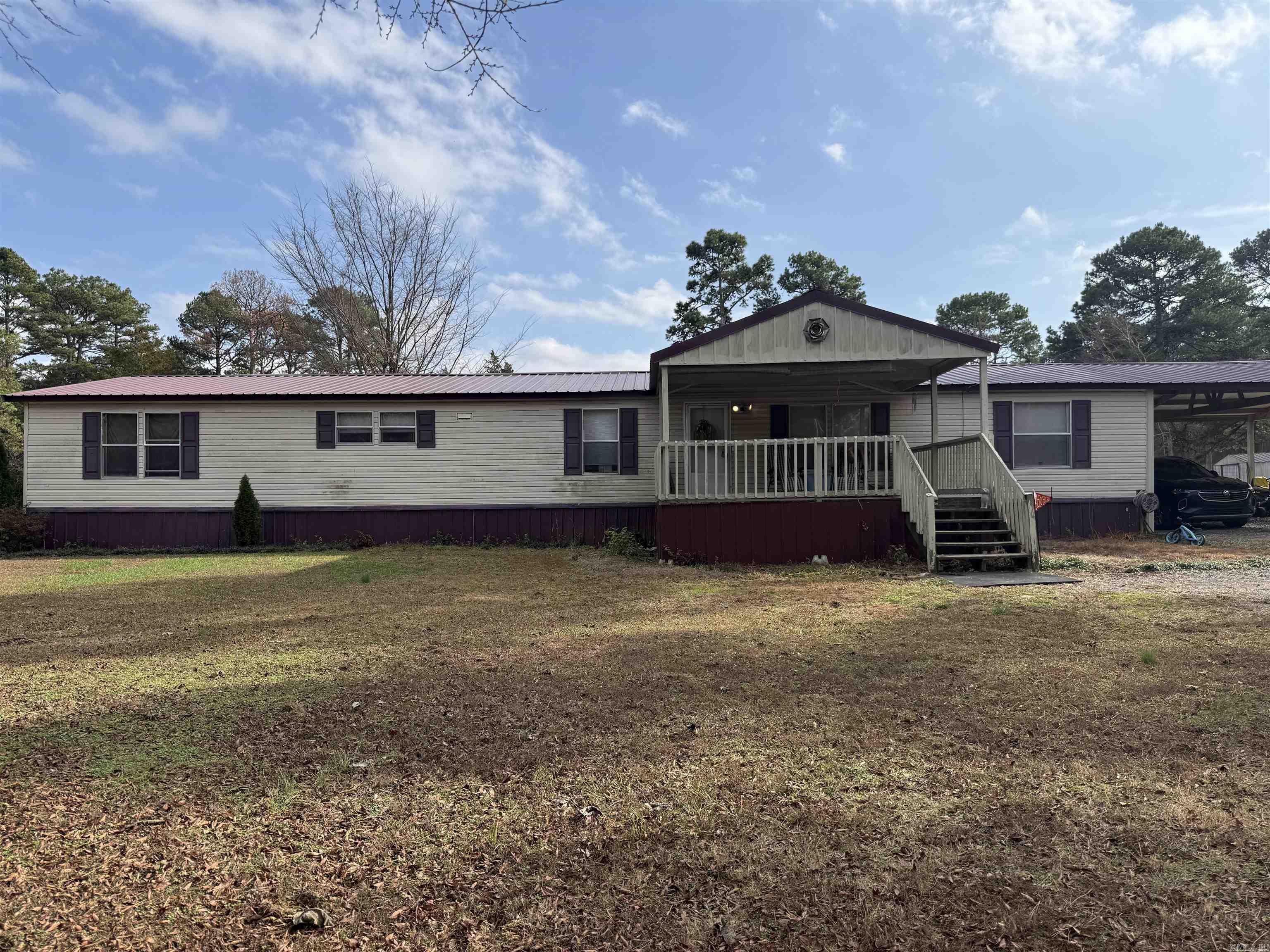 Back on the market at no fault of the seller. Spacious and well-maintained 4-bedroom, 2.5-bath mobile home situated on 2.71 acres, offering room to spread out while still enjoying convenient access to town. This home features two separate living rooms, perfect for entertaining, a play area, or a home office setup, along with a dedicated dining room for gatherings and family meals. All bedrooms are generously sized, providing comfort and privacy for everyone. One living area is highlighted by a cozy gas logs fireplace, adding warmth and charm to the space. The thoughtful floor plan makes everyday living easy and functional. Outside, you’ll appreciate the metal roof for durability and low maintenance, a two-car carport for covered parking, and multiple fenced areas ideal for pets, gardening, or creating separate outdoor spaces. Enjoy peaceful country living with the convenience of nearby Bald Knob or Batesville, making this property an excellent opportunity for those seeking space, comfort, and accessibility. Call to schedule a showing.