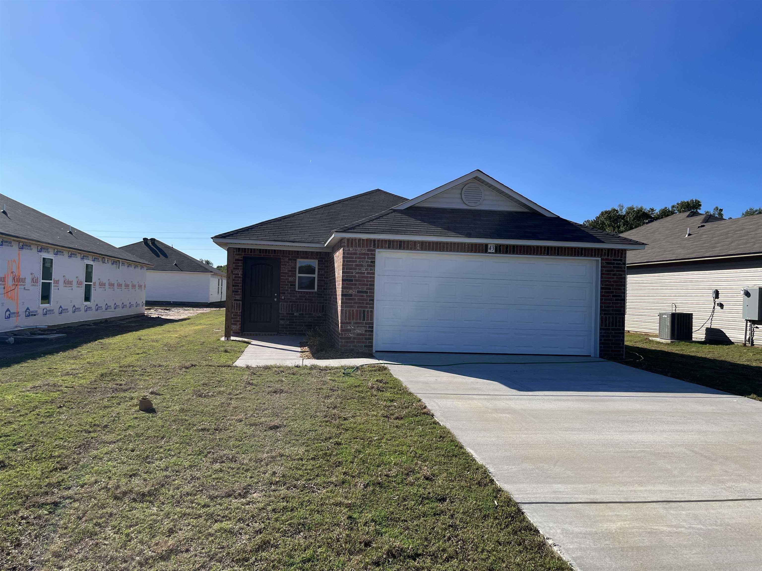 The convenient Mitchell plan! This home has a welcoming entry that opens into a Living Room with plenty of natural light. The eat-in kitchen has a convenient layout and has a back door that opens to a covered back porch. The Master Bedroom boasts a generous closet that is separate from the Master Bathroom.  Upgrades included in this home: 3050 Low E window in Master Bedroom, plumbing faucet upgrade 2, crown on Kitchen cabinets, 16" laminate bar top in Kitchen, Luxury Vinyl Plank flooring in wet areas and Living Room and adjacent hallways, raised ceilings in Living Areas per municipal requirements, Cheyenne style interior doors, baseboards level 2, attic stairs, LED disk lights in Kitchen, full sod, microwave hood in Kitchen, smooth top range.   THIS HOME IS COMPLETE.
