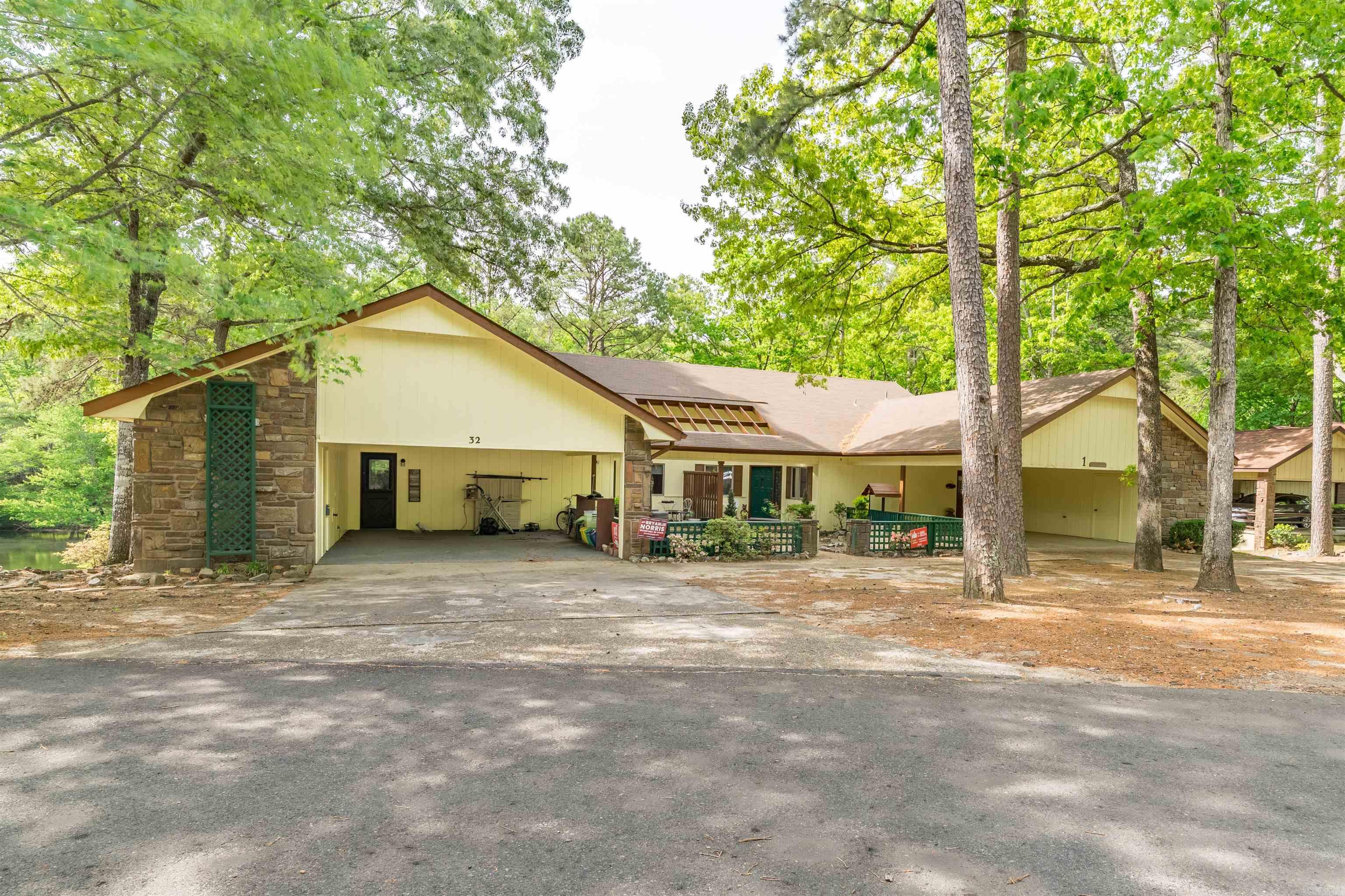 Lake living at its best. Great 3/2 condo on one level. Great floor plan with all the room one would ask for.  Completely redone, paint, flooring, new walk in shower. Large living area with fireplace. Kitchen has all the storage place one could ask for. . Got to put this one on your see list. All done in past 10 years new built-in microwave and oven   new air conditioner new flooring some new windows new paint inside and out new roof new bathroom new hot water heater new ceiling fan and dining room light new ceilings cleaned and sealed fireplace chimney new dock  new window coverings