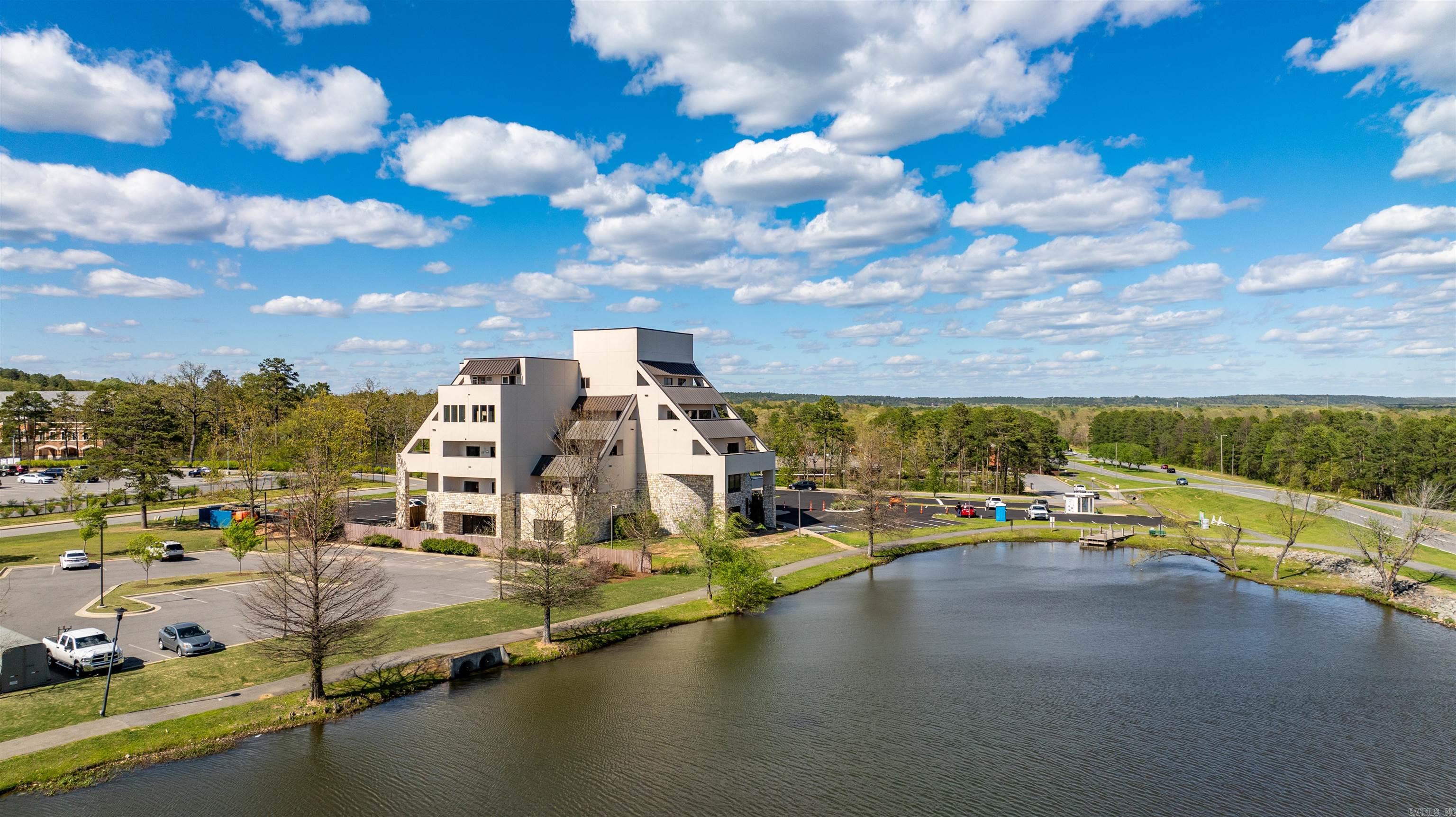 Welcome to this most Iconic Building in Maumelle. This magnificent 3-bedroom, 2-bathroom condominium located in the middle of Maumelle, AR. This residence spans a generous 2750 square feet, boasting an open, spacious layout 3 bedrooms, 3 baths, huge laundry room and an oversized private balcony over looking Lake Valencia! Oversized windows fill every room with abundant natural light, amplifying the charm of its hardwood flooring.  Live in the most Iconic Building in Maumelle!!! Recently completely renovated inside and out this building is a staple to Maumelle and living in luxury is what you will receive. For your convenience, the rent includes yard maintenance and trash service, while dedicated parking is available for tenants.  How about calling this charming condo home? Contact us for viewing arrangements and further details.
