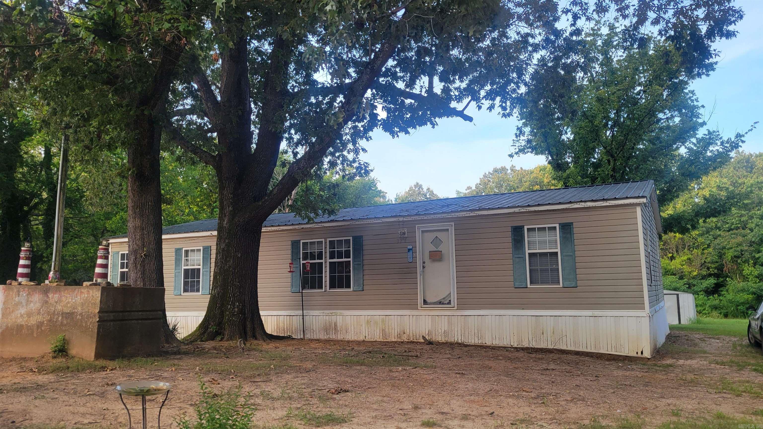 Mobile home located in Black Rock.  Features 2 bedrooms, 2 bathrooms and is situated on one acre.  Wooded lot. Home is being sold as-is. Storage building in backyard.