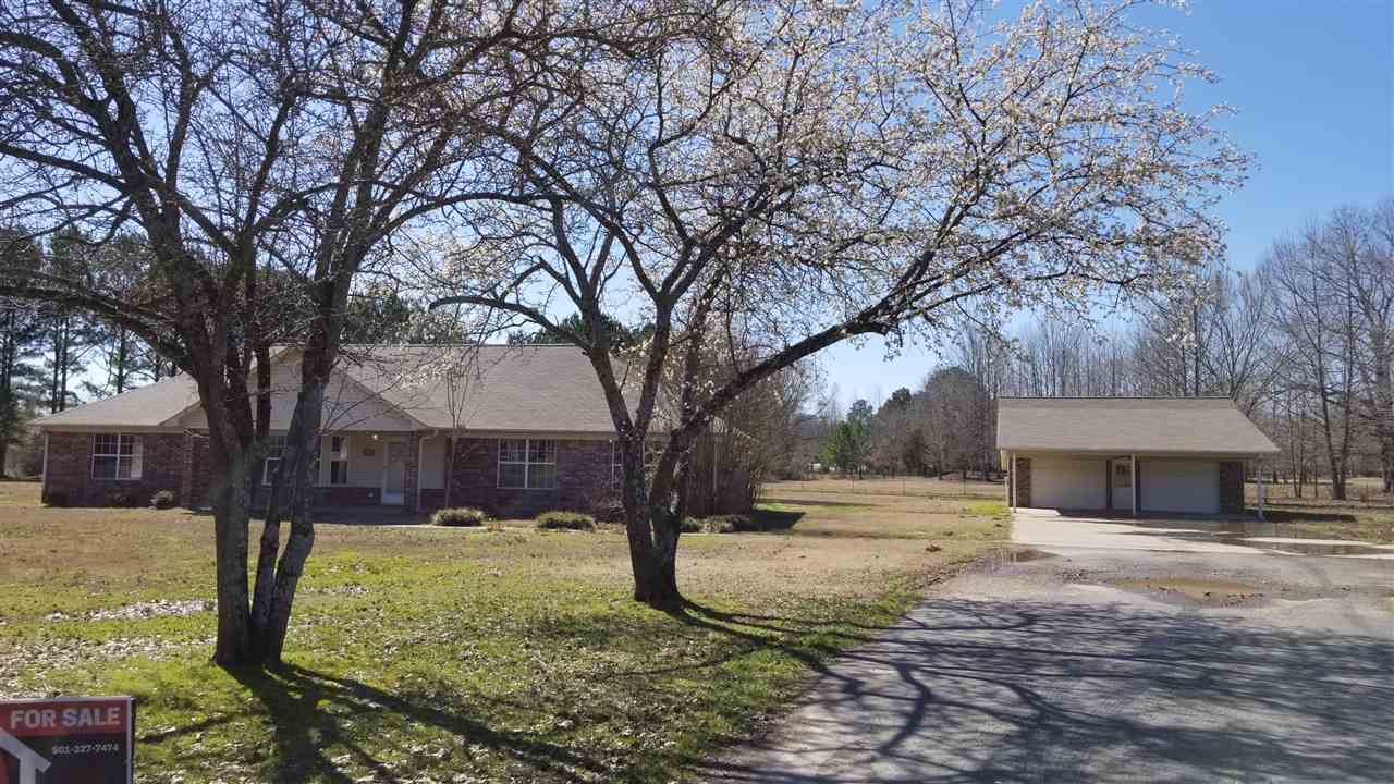 Large beautiful home sitting at a dead end street on 1.5 acres only minutes from the interstate! This home features wide open floor plan with split bedrooms, 2 master suites, a huge living room with vaulted ceilings, separate den with fireplace, large walk in laundry room and a separate shop that is heated and has a half bath. This home has everything you could want! Sold as-is.  "May be eligible for seller (vendee) financing".