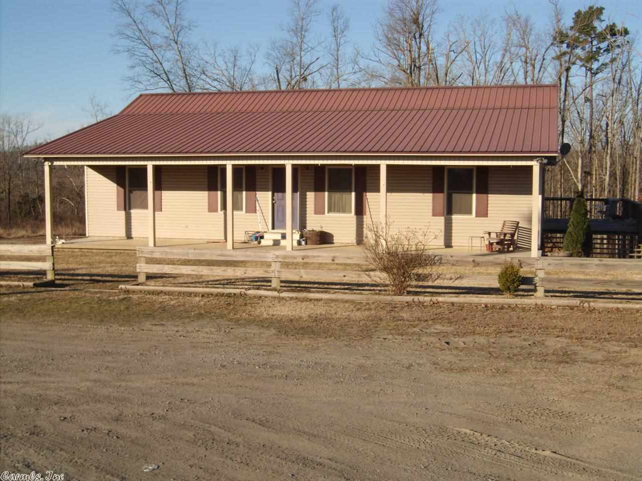 Great Rustic Home, back off the road for privacy, home has oak hardwood & tile floors, stainless steel appliances, cedar siding walls, corrugated metal ceilings, wrap-around deck, metal roof, 4.38 acres, fenced & cross fenced, set up for horses with 30'x40' metal siding barn, electric & water, separated stalls and large tack room, a must see.
