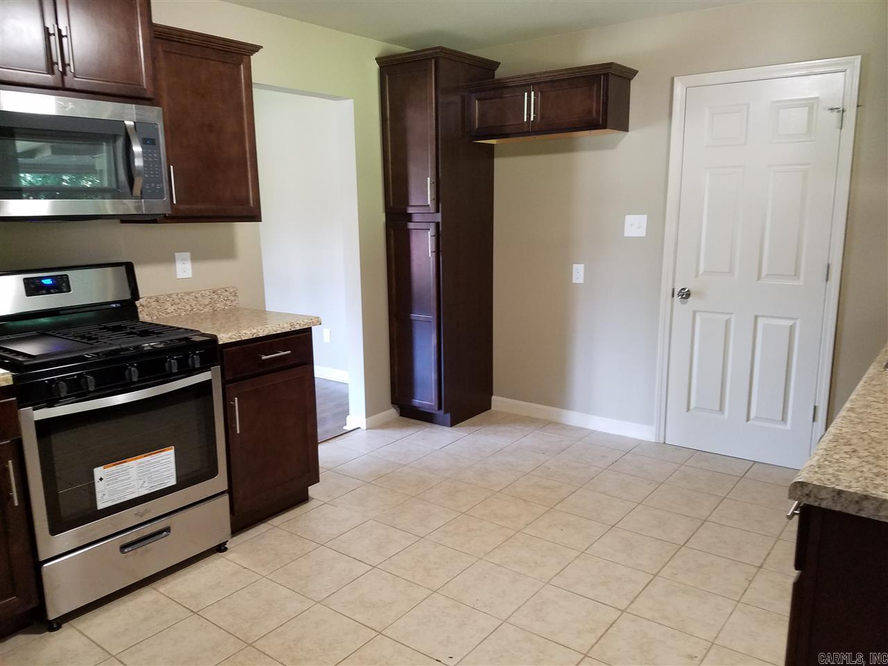 Cute, completely renovated, all-brick, perfect starter home WITH A LAKE VIEW!! Features a nice, fenced backyard and has newly refinished floors, new windows, countertops, range, dishwasher and HWH. Enjoy your morning coffee on the covered patio! Centered in the heart of LR, this home is convenient to everything - you can even walk to UALR! Call to schedule a showing today.