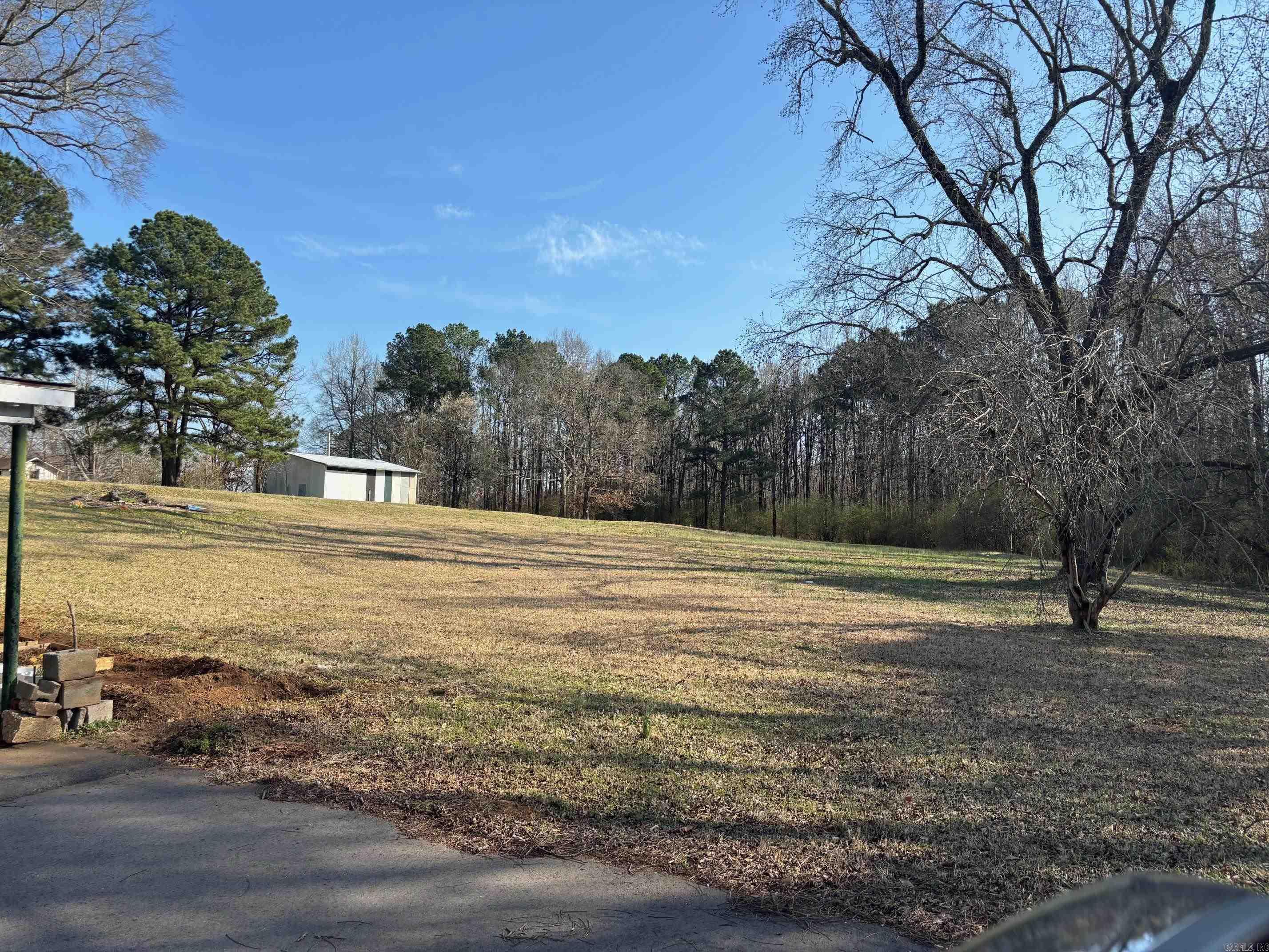 16 acres in the heart of Sheridan*all city utilities*2 houses, shop and a food truck area* 411 West Center rents for $800.00 a month  101 South Arch is in bad shape and rents for $400.00 a month.  The property has road frontage on three sides. The food truck spot rents for $600.00 a month. (the food truck trailer and all its improvements belong to the tenant) 700-00578-000 700-00574-000 700-01401-000 Google Earth View under mls documents.