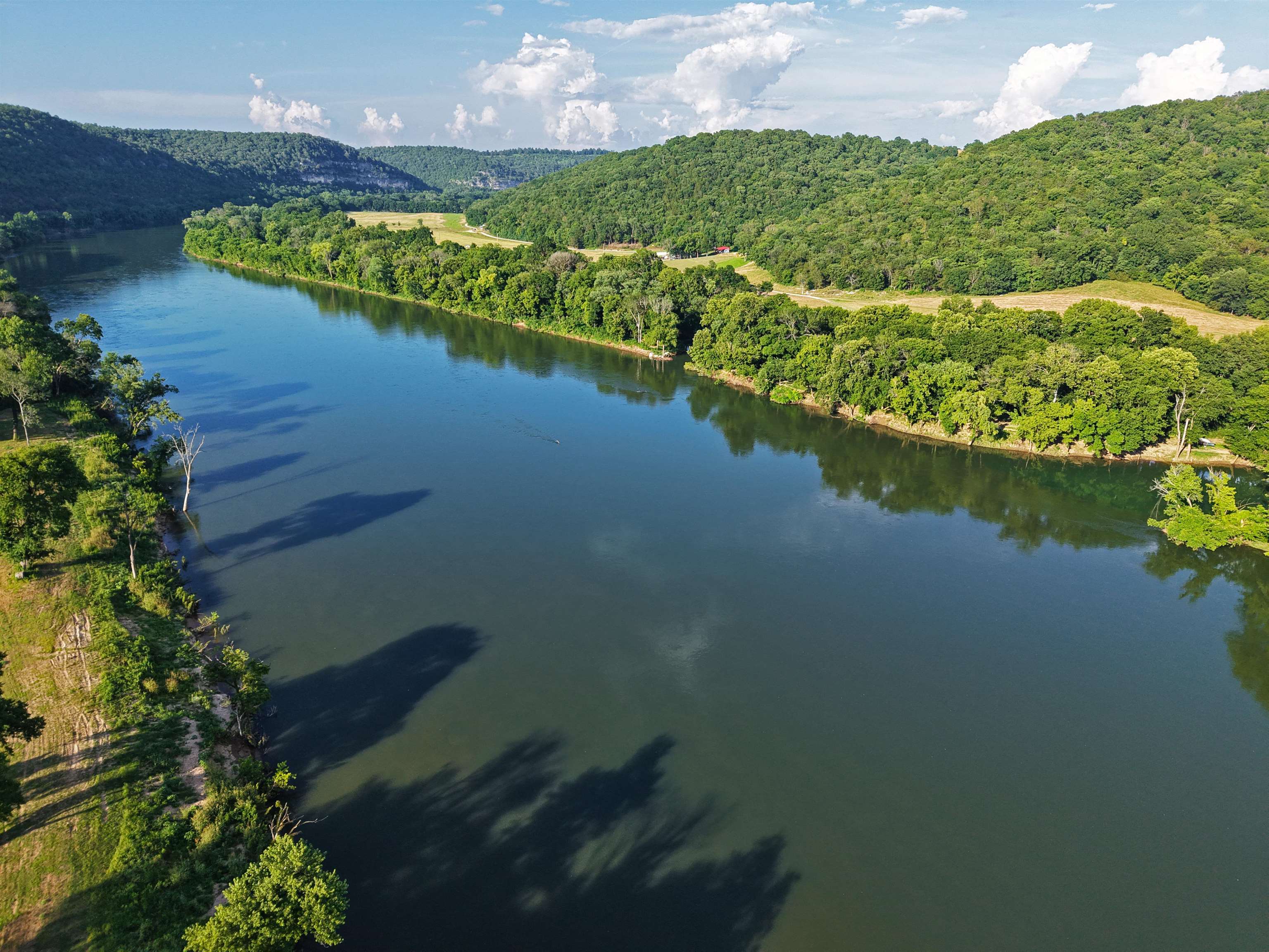 This property features 1.74 acres of riverfront land on the White River, offering a clear, mostly level homesite that gently slopes down to the water’s edge. Mature shade trees are scattered along the river, providing a natural setting without obstructing access to the shoreline. The property includes an existing well, with electric co op service and high speed fiber available on the interior side of the tract. The lot’s layout allows space for a future home, cabin, or recreational setup, as well as room to enjoy on site boating, canoeing, camping, RVing, and fishing opportunities from your own frontage. This tract may appeal to buyers looking for river access, utilities nearby, and a mix of open ground and trees in a rural setting.