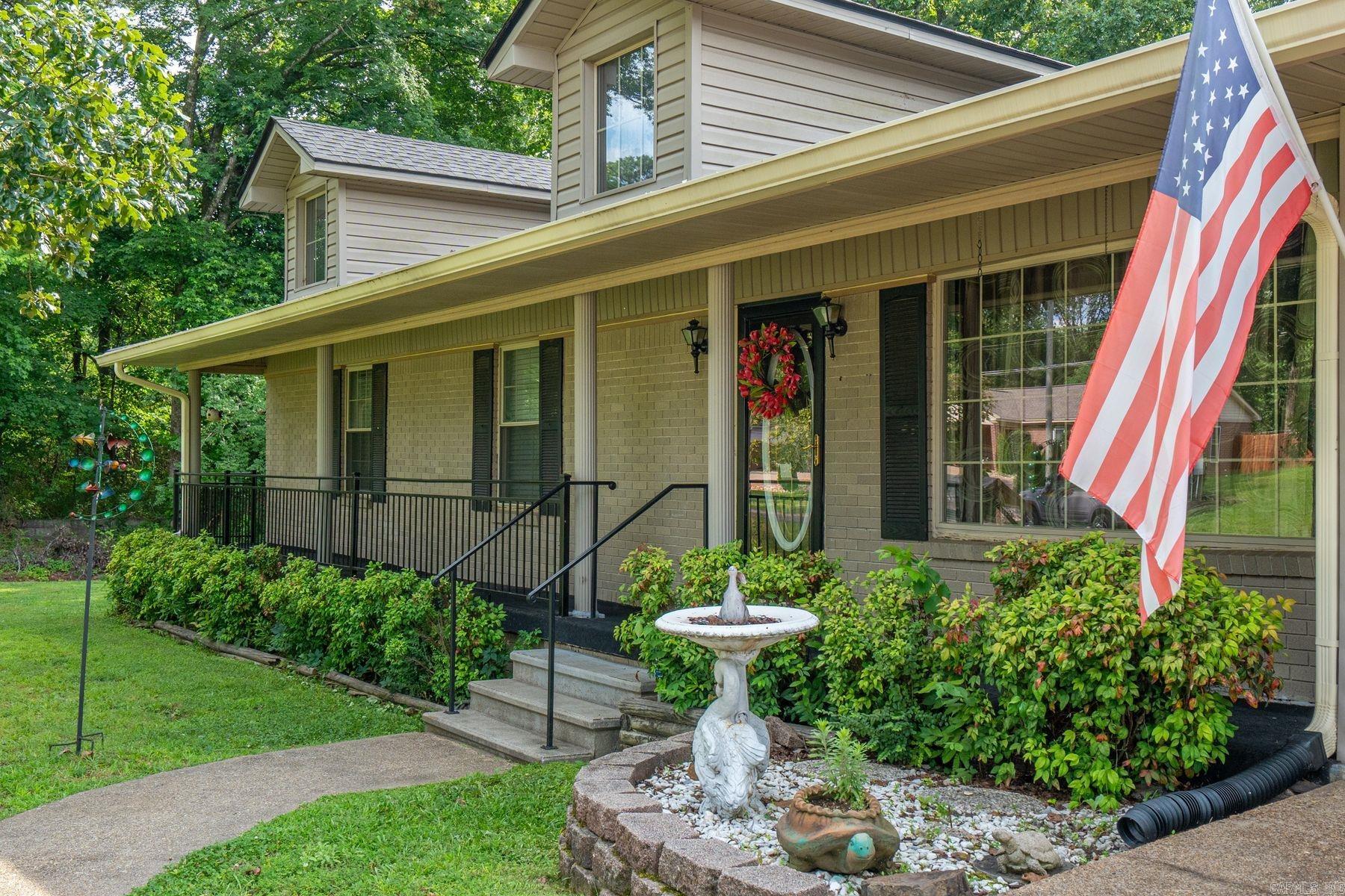 With curb appeal worthy of “Southern Living” magazine and a rare single-level layout, this charming Forest Heights home offers comfort, convenience, and an excellent opportunity to add equity in the Lake Hamilton School District. Situated on a level corner lot, the property features 2,028 sq ft of heated/cooled living space plus a 288 sq ft enclosed sunroom, perfect for spring and fall. Inside includes 3 bedrooms, 2 baths, a spacious living room, oversized den, and a custom kitchen with solid-wood cabinetry and pull-out storage. A dedicated laundry room and ample living space provide functionality for everyday living and gatherings. Major updates include HVAC (2025), roof (2024), replacement windows, and new garage doors. Outdoor features include a 2-car garage with epoxy flooring and two outbuildings with electricity—ideal for storage, hobbies, or a workshop. Conveniently located near Airport Road with easy access to Lake Hamilton Schools, dining, shopping, and healthcare. Sellers are offering a buyer choice of a $25,000 price reduction or $25,000 repair allowance with an acceptable full-price offer—creating an immediate equity opportunity.