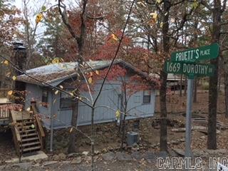 Incredible lake front property on greers ferry walk to the water.Across from  fair field bay marina.Tons of updates in last 4 years,Metal roof,all new bathrooms and floors stainless steel applainces.2 bedrooms and bath upstairs and 1 bedroom and bath downstairs plus game room w/pool table and fireplace.large deck on main level over looks private cove on water.Open airy great room with tons of windows plus cozy fireplace.Granite counter tops and bar.Not much to do on this house except move in and enjoy it.