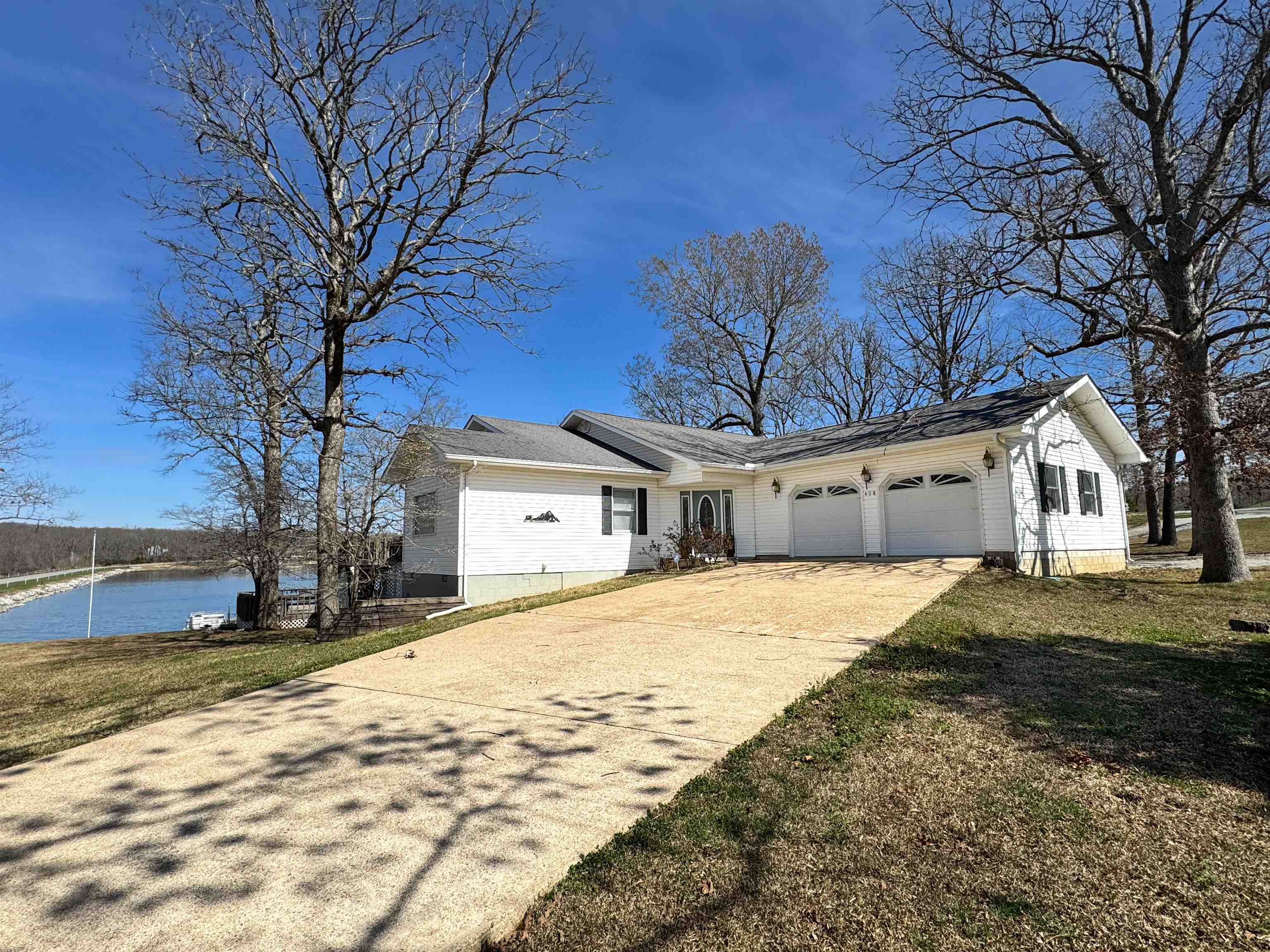 Lake days, sunset views, and weekends that feel like a getaway—this Crown Lake area home puts it all within reach. Located just minutes from Crown Lake Resort, you’ll enjoy quick access to boating, fishing, swimming, golf, dining, and more, with your own floating dock ready for the water.  Inside, the home offers a warm, welcoming layout with fresh flooring and paint throughout. The main level features inviting living spaces, a gas fireplace, and room to gather. The walk-out basement adds incredible flexibility with a second living area, kitchenette and dining space, plus a bedroom connected by a Jack-and-Jill bath to a versatile flex room—perfect for guests, hobbies, or overflow sleeping.  The primary suite is a true retreat with a unique flow: bedroom, sitting room, ensuite bath, and a spacious dressing room with multiple closets.  Recent updates include newer HVAC systems and a deck redone in 2024. Situated on two lots with vinyl siding, this property offers space, comfort, and the lake lifestyle you’ve been looking for.