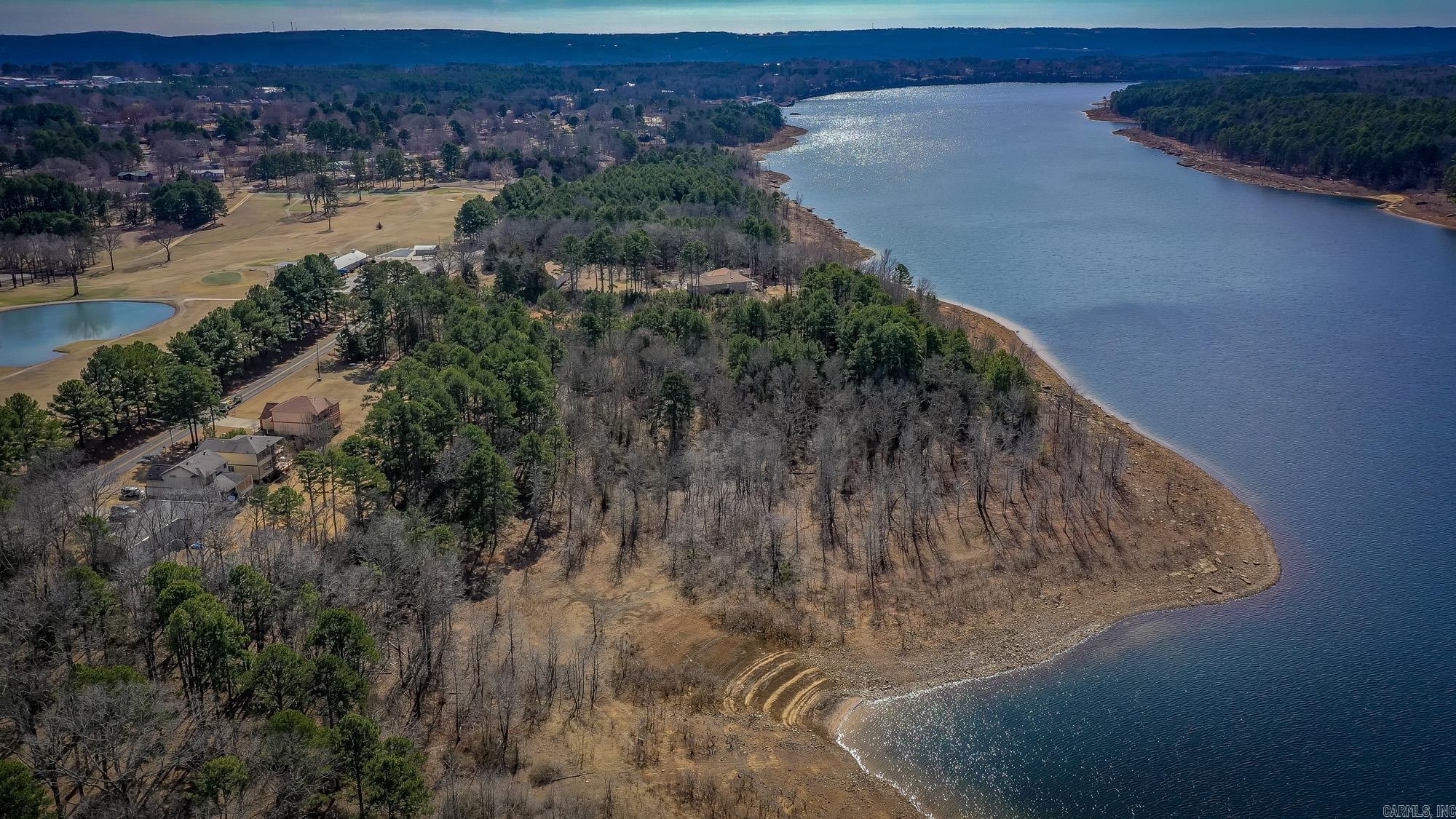 Heber Springs Lake Front Lot with Views of Greers Ferry Lake! Lot has gentle walk to the water and is located across the road from Thunderbird Country Club. Call today!