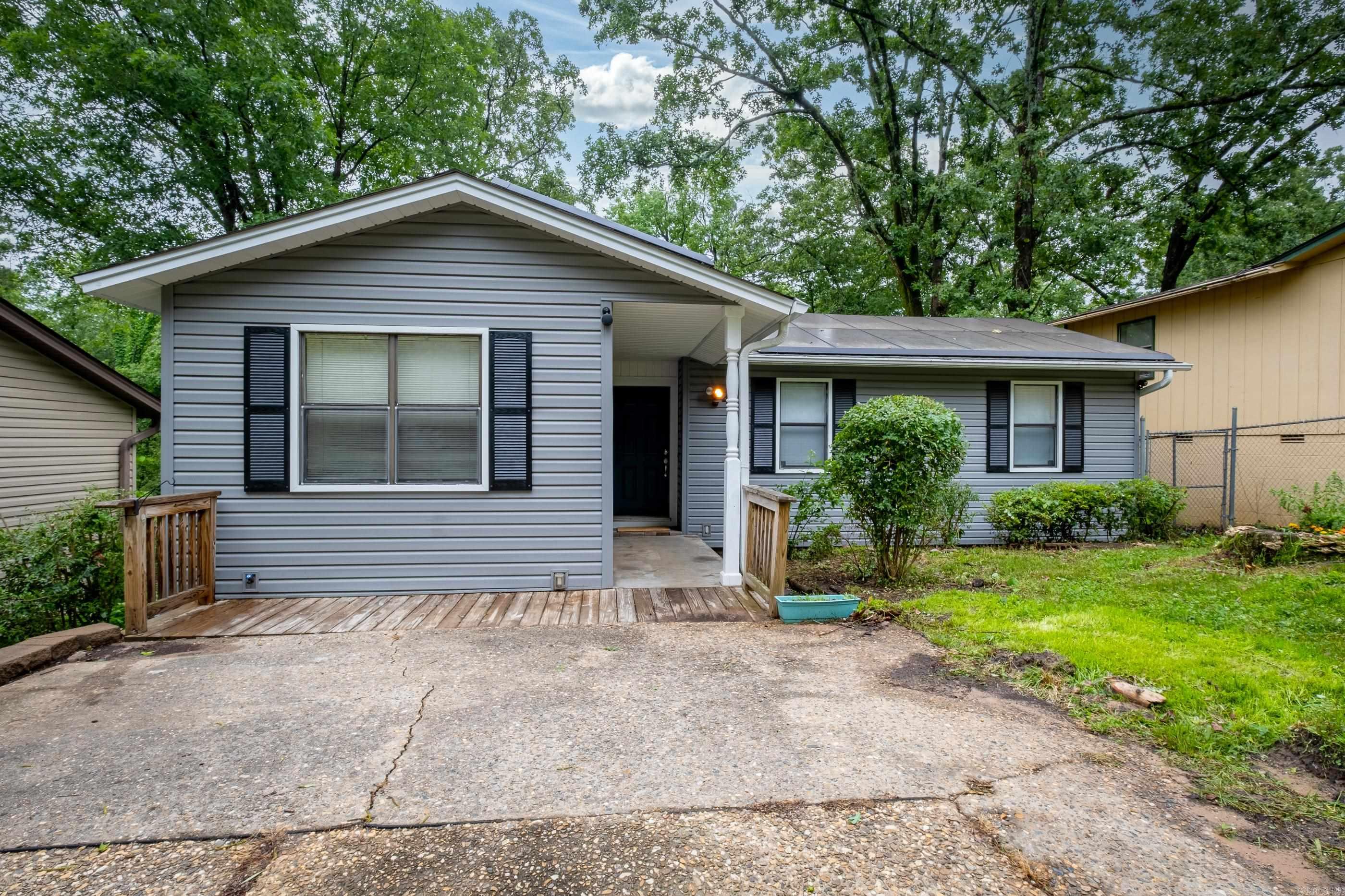 Charming WLR bungalow conveniently located near shopping & dining with easy access to Chenal Parkway.   This 3-beds and 2-full baths boasts a spacious Living Room w/built-in shelves and kitchen/dining area that are open concept with ample cabinet space. Updates include: Architectural Shingle Roof, HWH, Refrigerator, Dishwasher, Toilet, Water line & Regulator, HVAC unit, Siding & gutters, LVP Flooring LR & Kit, as well windows that feature “tilt to clean” design. Spacious deck overlooks fenced backyard w/storage bldg, encapsulated crawlspace AND Solar System w/Tesla backup battery - low electric bill.  **SEE AGENT REMARKS**.