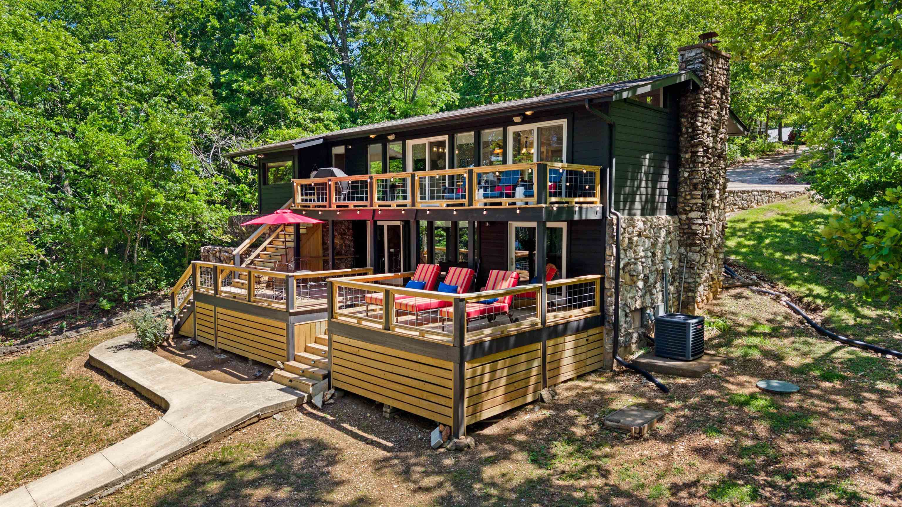 LOWECATION, LOWECATION, LOWECATION!  Welcome to the market, 53 Wyandotte on gorgeous Lake Thunderbird In Cherokee Village!  This home represents what happens when "Lake Life" and sophistication meet!  MOVE-IN ready and waiting for it's new owners.  Affectionately named "Trillium", this stylish home has been completely remodeled and used as a very successful short term rental for 2.5 years.  New roof and septic within last 2 years.  New exterior paint and decks within last year.  Covered boat dock with boat lift, and gentle sloping lot to the lake!  Inside an oasis awaits!  Flooring, paint, fixtures, appliances, windows are all updated!  Home can remain furnished with acceptable offer. Decor, decor elements, cabinet contents ,and boat are also negotiable, making this truly an exceptional deal!  Write an offer today and enjoy this home just in time for summer at the lake!  Whether you are making this your permanent home, weekend retreat, or short term rental, this home can check all the boxes.  Call your favorite Realtor for a showing ASAP!
