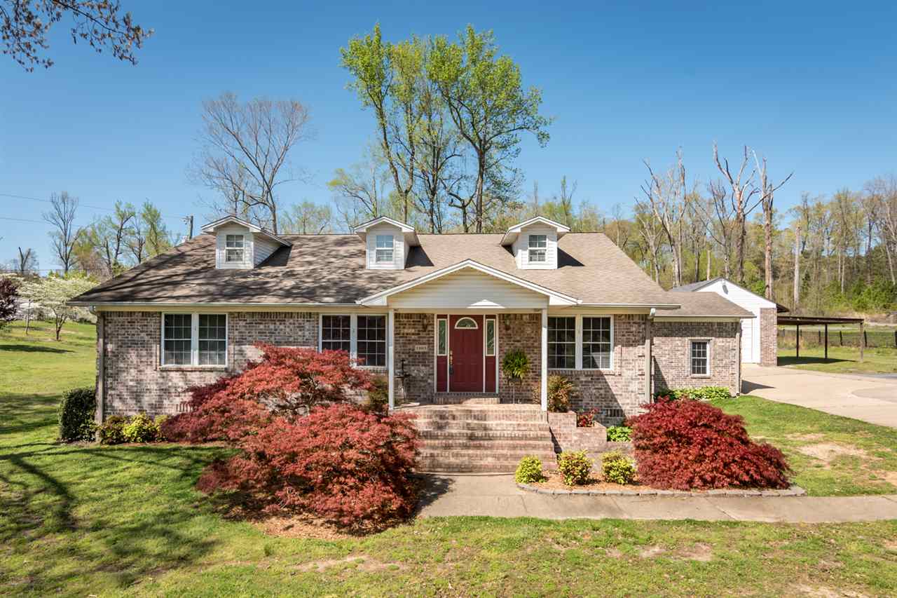 All brick house with great shop! Spit bedrooms with two master closets and double sinks in bath. Hall bath has two sinks/vanities. Separate dining room and office plus upstairs bonus room. Great circular driveway and electric gate. Beautiful landscaping and brick planters in front yard. Lots of space to call your own and a giant shop for all your hobbies. Lot size is estimated. About to get a new 30 roof! See showing and agent remarks.