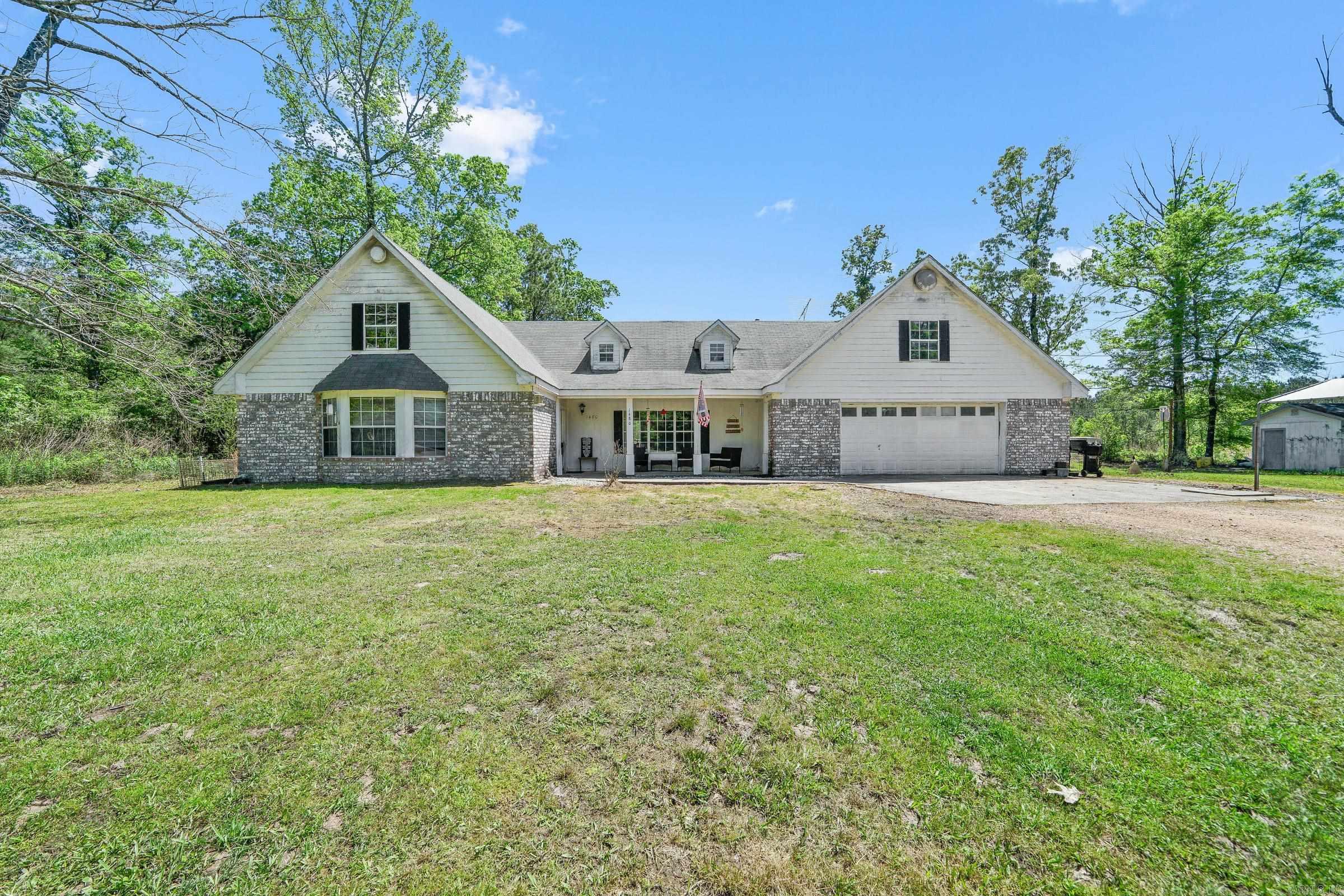 This large family house on 7+ acres is ready for a new family to call it home. Nestled back off of the road sits 5 bedrooms, 2 baths, 3 1/2 baths, two family rooms, a bonus room, office, and much more! On the second story you will find two bedrooms, each with a half bath, separated between a massive bonus room. The back overlooks the property with wonderful privacy. Property also includes a well shed/storage building as well as a former bait shop. Call today to schedule your tour.