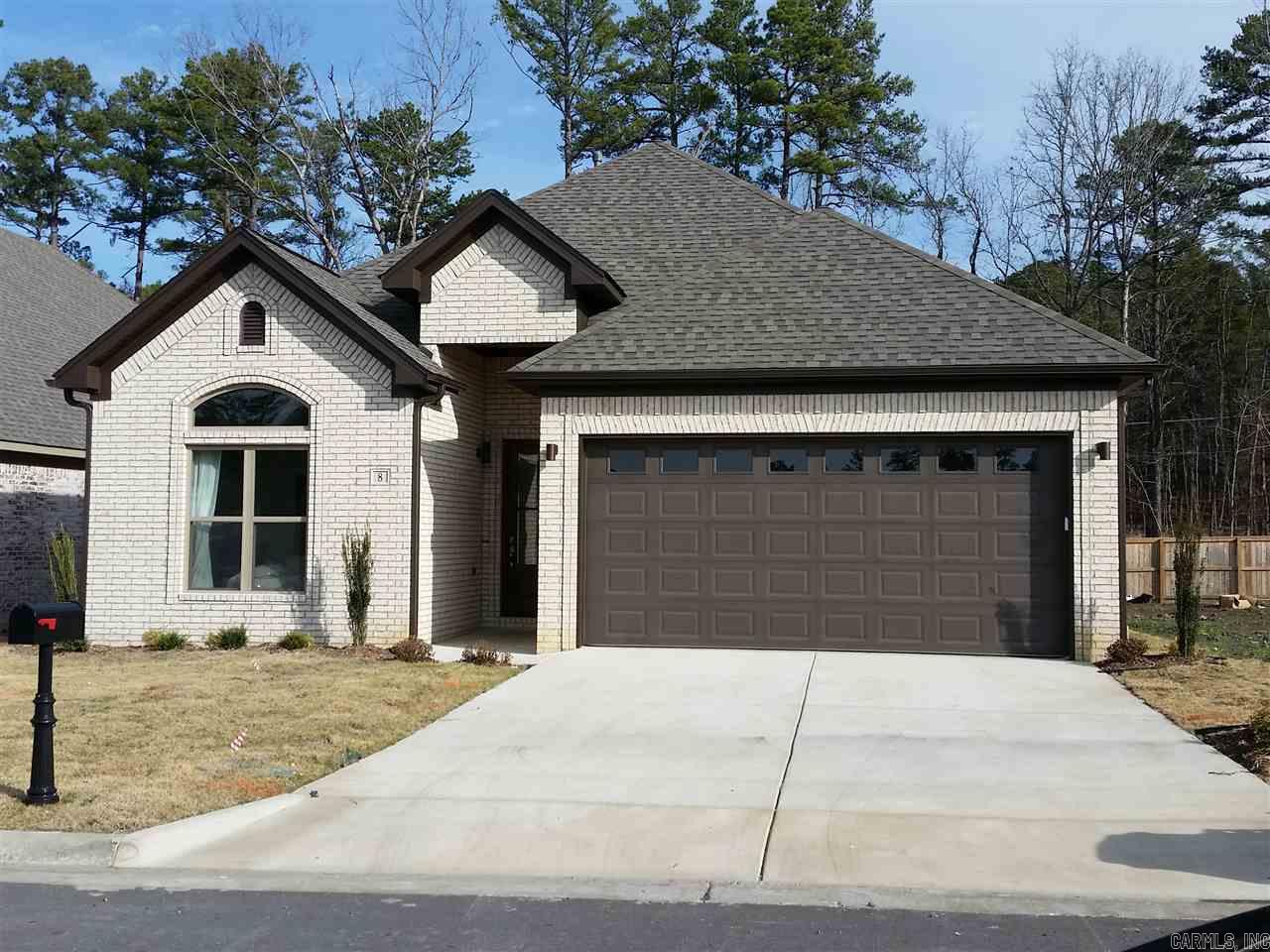 Custom touches throughout with hardwoods; granite, tiled showers, covered patio, tiled floor to ceiling fireplace.  Open plan with center island; granite in kitchen/baths; Fabulous master bath suite; 10' and 12' ceilings; covered patio; fenced back yard with iron gate.