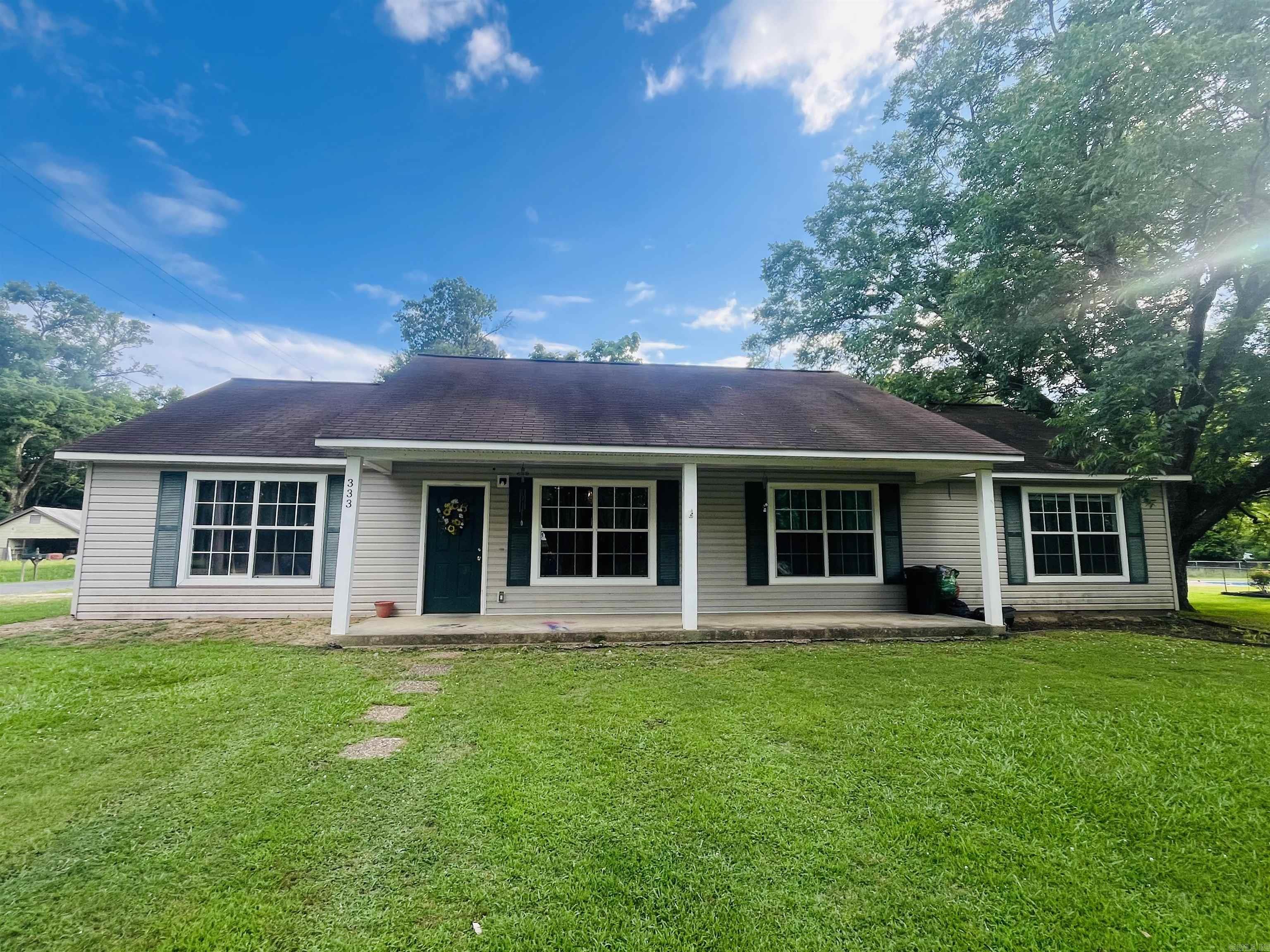 Welcome home to this spacious 1,891 sq. ft. property conveniently located between Malvern and Arkadelphia. Situated on a corner lot, this home offers both comfort and functionality for today’s lifestyle. Step inside to discover an inviting open-concept floor plan that’s perfect for entertaining and everyday living. The master bedroom is separated from the additional bedrooms, providing added privacy and a peaceful retreat.  Outside, you’ll enjoy a fully fenced backyard complete with a cozy fire pit—ideal for relaxing evenings with family and friends. A storage building provides extra space for tools, equipment, or hobbies, while the 2-car carport offers convenient covered parking. Schedule your showing today!