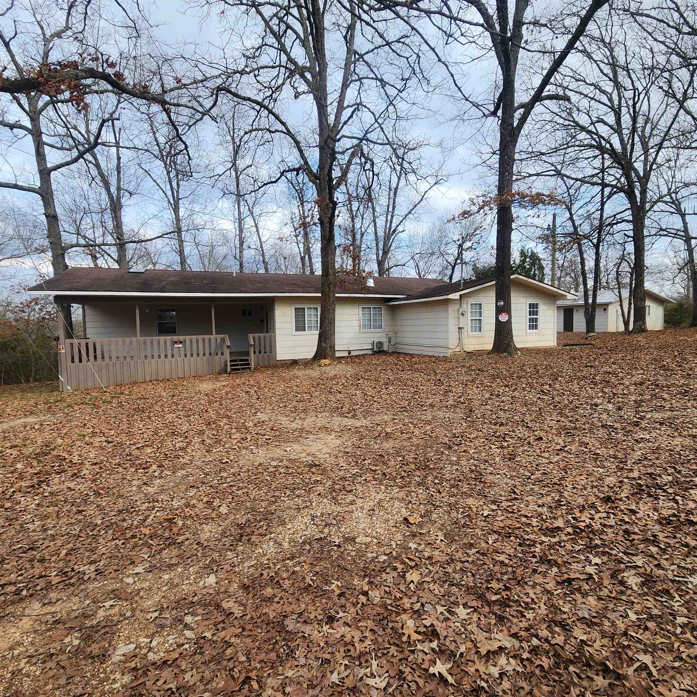 Must see home with 3 or 4 bedrooms and 2 baths, make up this updated home with a 2-car detached garage/shop in Highland Arkansas. Lots of updates including a huge Master Bedroom and Bath with a walk-in closet located at one end of the home. Separated by the kitchen, living room, dining area laundry room and the 2nd bathroom are 2 or 3 more bedrooms. depending on how you want to use the middle room. It could be used as a nursery or office as well. The 2-car detached garage has a large office on it as well it could be a guest room for overflow guests or as an office if someone wanted to use the garage as a workshop.  Schedule you're showing and see this wonderful property as soon as you can.