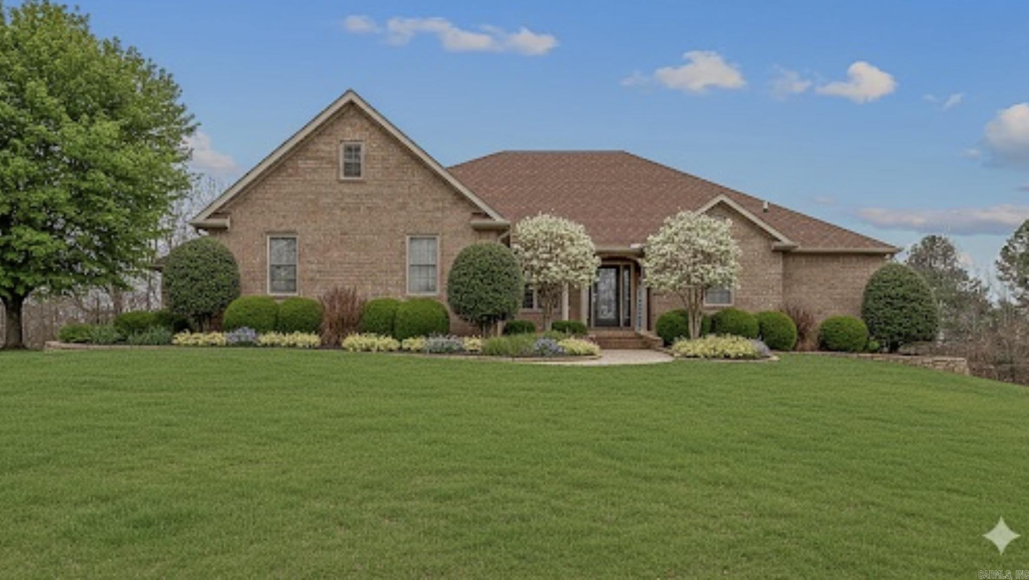 Spacious 4,000 sq ft home on 14.44 private acres with exceptional shops, luxury touches, and resort-style outdoor living. The main level features a large laundry/mudroom, custom kitchen with quartz countertops, island/breakfast bar, built-in office, and breakfast nook. The primary suite boasts a generous walk-in closet, while a split layout provides four additional bedrooms—two share a Jack-and-Jill bath, one has a private en-suite, plus a half bath. Custom cabinets, hand-scraped bamboo floors, travertine tile, and custom blinds elevate the interior. Spray foam insulation and two tankless water heaters enhance comfort and efficiency.  The basement offers a large game room, a second room for theater or office, and a half bath, plus an upstairs bonus room. Outdoors includes a 16x32 saltwater pool with slide and diving board, cabana, 6-person hot tub, and two shops—a three-car garage shop with electric and a 24x30 shop with 14’ walls with electric and water. A backup generator and wide-open acreage provide privacy, work, and play space. (See agent remarks)