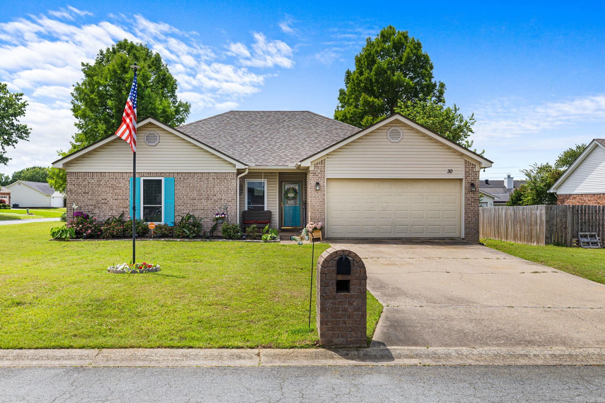 Welcome home to this beautifully maintained 3-bed, 2-bath home offering 1,582 square feet of comfortable living space in an established neighborhood convenient to shopping, restaurants, and everyday amenities. Inside, you'll love the upgraded wood laminate flooring, cozy gas fireplace, and desirable split floor plan that provides added privacy with the primary suite separated from the guest bedrooms. Kitchen has a pantry and the refrigerator stays.  Major updates include new windows and roof in 2022, giving peace of mind for years to come.  Situated on a corner lot with a fully fenced yard.  This home offers the perfect blend of comfort, convenience, and charm.  Don't miss your opportunity to make this one yours!
