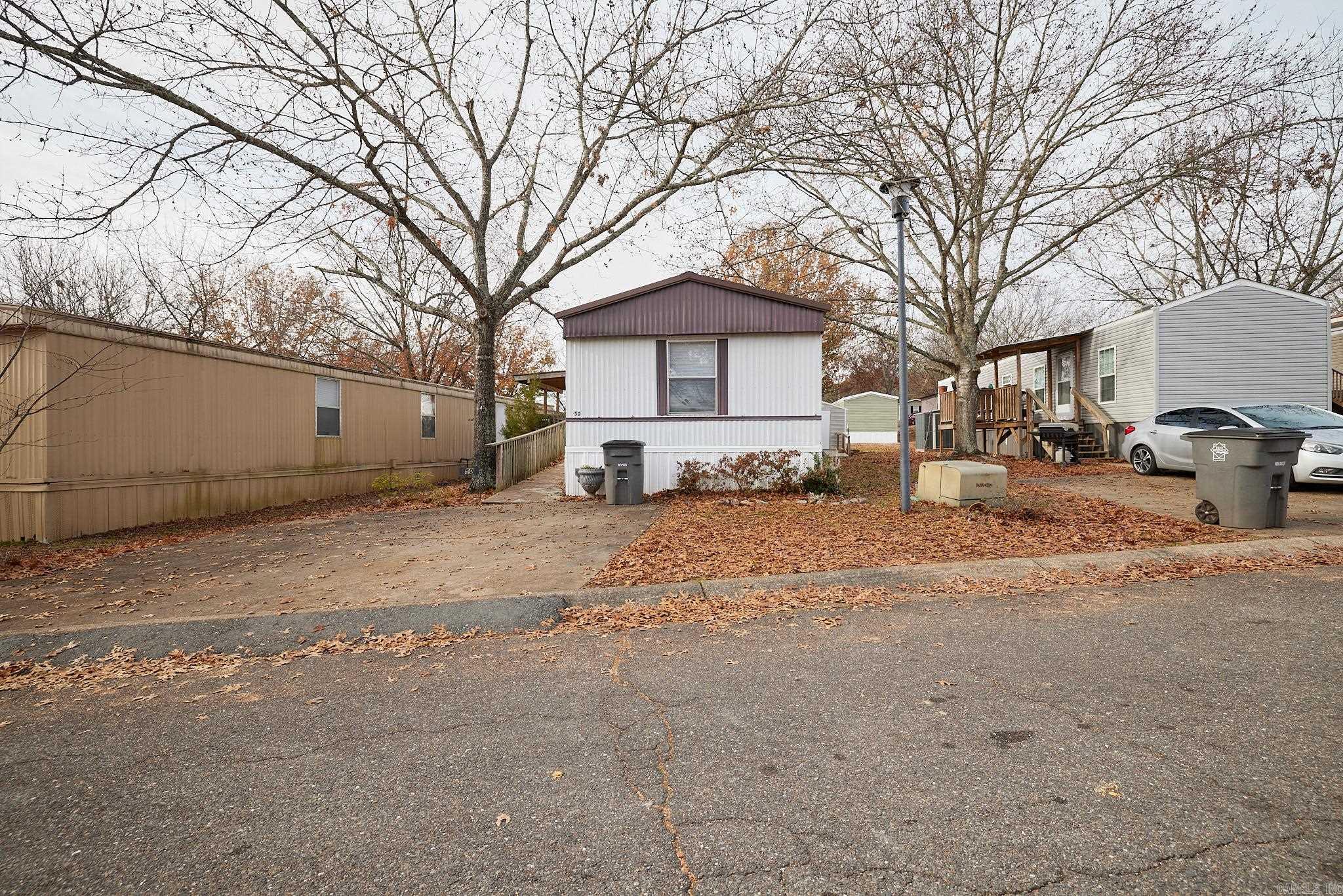 Affordable Living in a Quite Established Well Maintained Park.  Come See this 3 Bedroom, 2 Bath, 2000 Belmont Located in Combs Friendly Mobile Home Park.   This Place is Adorable.  You will enjoy the 8 x 10 Storage Shed for all your garden Tools.  All Appliances Convey