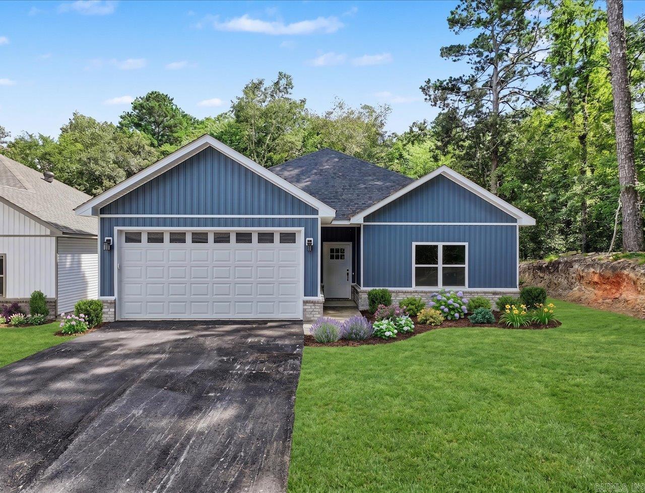 Discover this brand-new home in one of the most desirable areas off Marion Anderson Rd-located in the coveted Lake Hamilton School District and out of the city limits! Step inside to an inviting open floor plan, soaring vaulted ceiling, and a show-stopping designer LED electric fireplace that elevates the living space. Luxury touches are found throughout, including a modern neutral color scheme, white quartz surfaces, 9 ft ceilings, His/Her walk-in closets, and solid core interior doors for that high-end feel. Thoughtful upgrades set this one apart-automatic closet lighting adds convenience, while auto defrost bathroom mirrors provide a spa like experience everyday. The kitchen is fully equipped with all appliances, making this home move in ready from day one. Starlink internet. Agent/Owner.