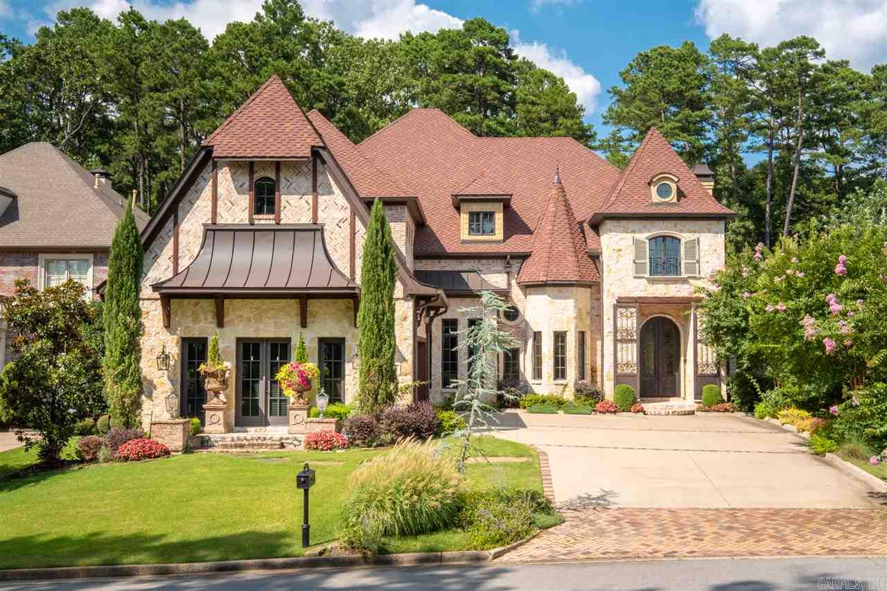 Custom showcase, gated, adjoining Chenal CC. Outdoor entertaining- covered veranda, 2 outdoor FP, salt water heated pool/waterfall spa, outdoor TV & pool bath. Travertine floors, wet bar, hearth room, open floor plan, mud room, 2 laundry rooms. Chef's kitchen- gas 6 burner/griddle Thermador, pot filler, granite, built-in frig. Master- soaker tub, dual sided shower, 2 water closets. Theater- mini kitchen. Central vac, mosquito mist, intercom surround sound, extra landscaping, cameras. POA does all lawn care.