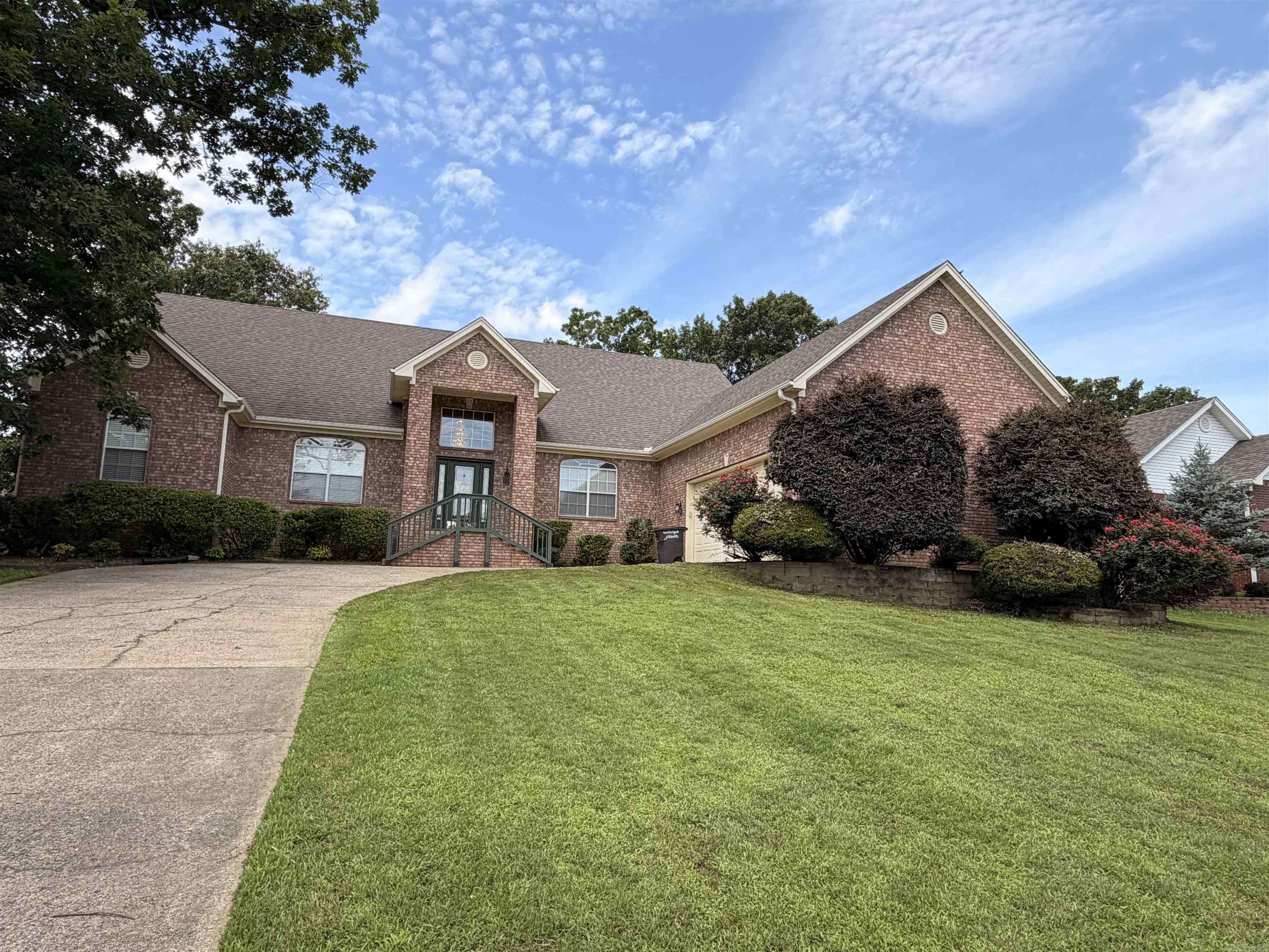 Nestled in a desirable gated community, this stunning 5,104 SF home offers 3,454 SF on the main level and 1,650 SF upstairs. Designed for both comfort and entertaining, it features 4 spacious bedrooms, 3 full baths, a bonus room, private office, formal dining room, and a breakfast bar. A dramatic two-story foyer welcomes you into a home showcasing beautiful hardwood floors, elegant crown molding throughout, 10-foot ceilings downstairs, and 9-foot ceilings upstairs. The bright, spacious kitchen features granite countertops, abundant cabinetry, and plenty of workspace. Custom closet shelving, generous storage, and a convenient laundry chute add everyday functionality. Whether hosting family and friends or enjoying a quiet evening at home, this move-in ready property offers the perfect blend of style and practicality. A new AC unit installed in 2026 provides added peace of mind. Don't miss this exceptional opportunity—schedule your private tour today!