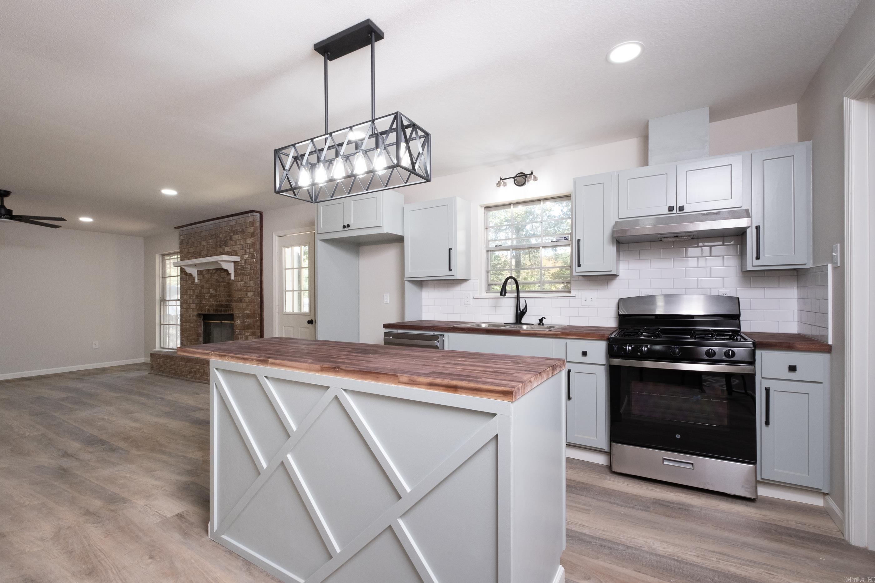This fully remodeled 3-bedroom, 2-bath home combines modern upgrades with style and comfort, located just a few minutes from Benton Downtown and a few blocks from local schools. The property features new flooring, fresh paint, and updated light fixtures throughout, creating a bright and welcoming atmosphere. The kitchen boasts brand-new appliances, making it move-in ready. Step outside to a spacious brand new deck in the backyard, perfect for entertaining and relaxation. As an added bonus, the seller is offering a 1-year home warranty (buyer's choice) for peace of mind. Agents see remarks.