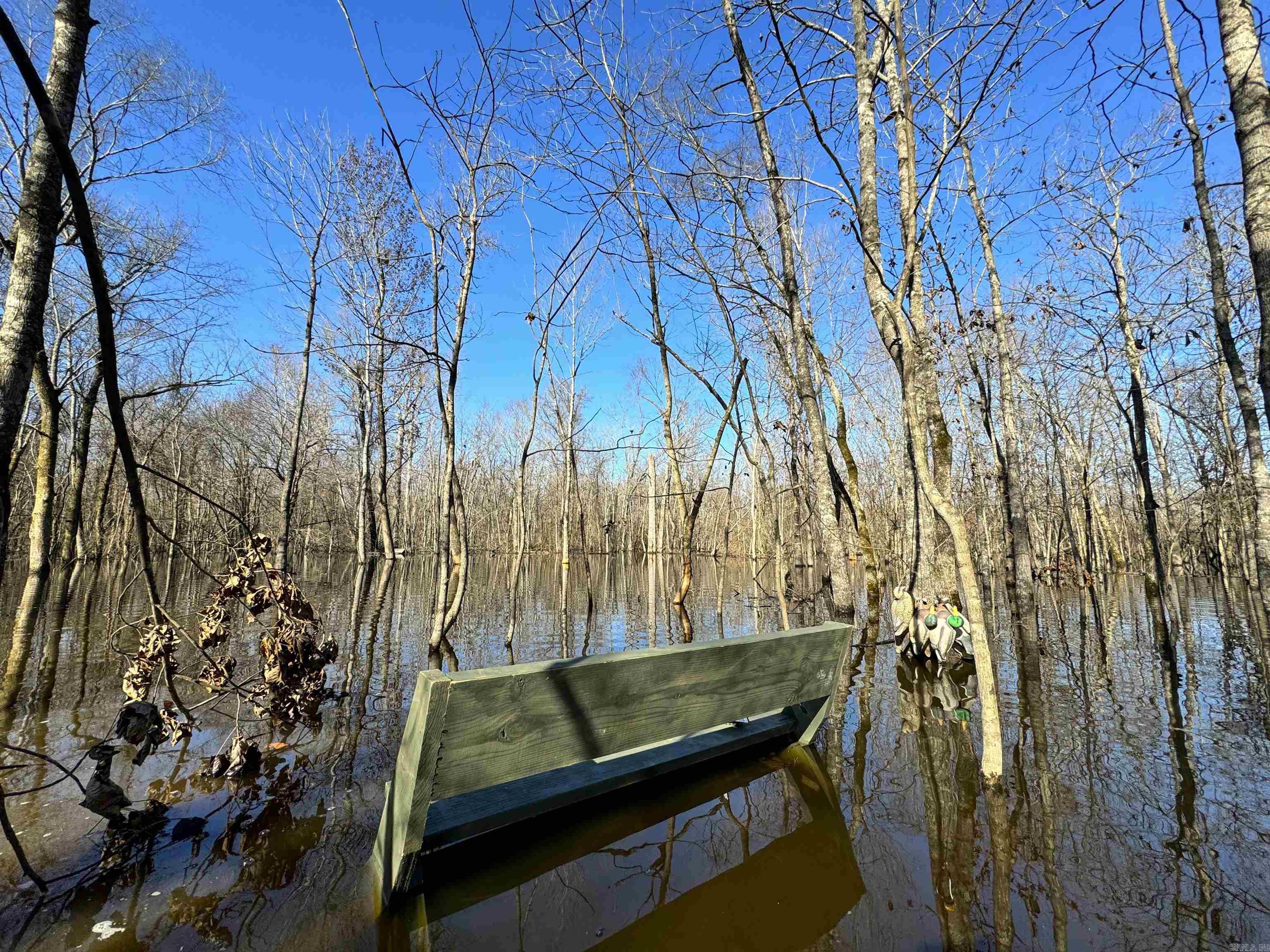 If you are looking for a duck property and lodge anywhere in the $1 million - $2 million range there is not another option on the market I'm aware of that competes with the attributes of this offering. This 113.49 surveyed acres is located just South of McCrory, Arkansas placing you between the Cache River and Bayou DeView and in the area of some of the states' most renowned clubs such as Coca-Cola and Strait Lake. This tract has a fully renovated lodge, flooded timber, plus both field and old fish ponds for combinations of crop and moist-soil management for waterfowl food sources. The 3 bed, 1 bath lodge has just been completely renovated and it's evident the sellers spared no expense. From the dark, leathered granite countertops, tile shower, new HVAC, new windows, new roof, new flooring, new appliances, and heated/cooled mudroom you will be hardpressed to find one done better. Just behind the lodge is 78 +/- acres of flooded green timber. Tillable acre and fish ponds with independent risers to multiple ponds for micromanagement of food and water. 450 ML acre lease joins this tract on the South to provided additional acreage to hold ducks and increase hunting opportunities.