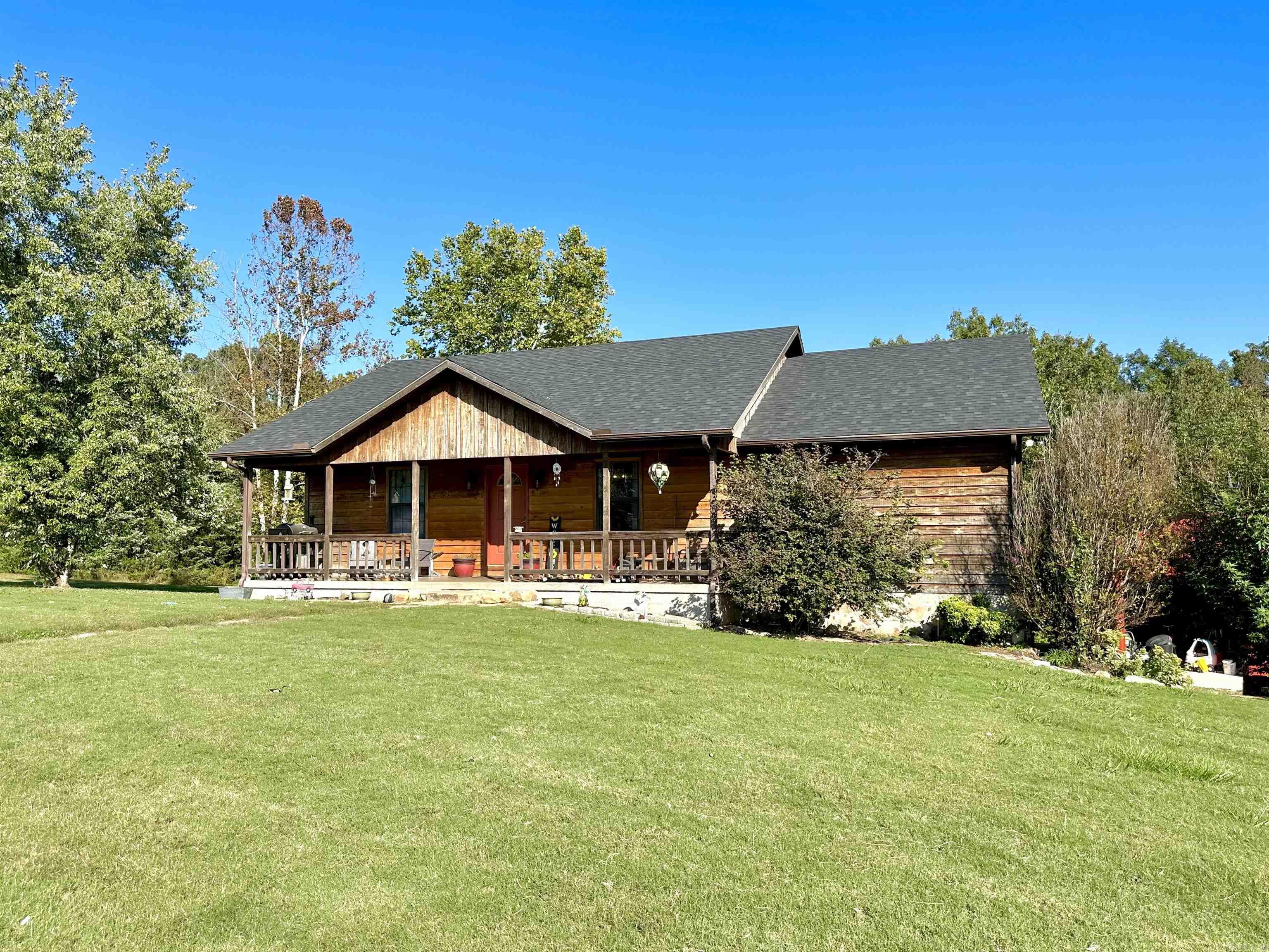 Well maintained 3 bedroom/2.5 bath home on 5 acres outside Calico Rock. The living area has a vaulted ceiling and access to a large back deck! The open kitchen/dining area has custom hickory cabinets. The master bedroom offers a walk in closet & a full bathroom with a walk in shower. The basement makes a great family room/game room & has a 1/2 bath, storage space, & oversized 2 car garage. There is a 24x32 shop, above ground pool, tree house, chicken coop, & entertainment area outside! The home has a new roof & new HVAC system that is 1 year old! Located close to Norfork Lake and the White River!
