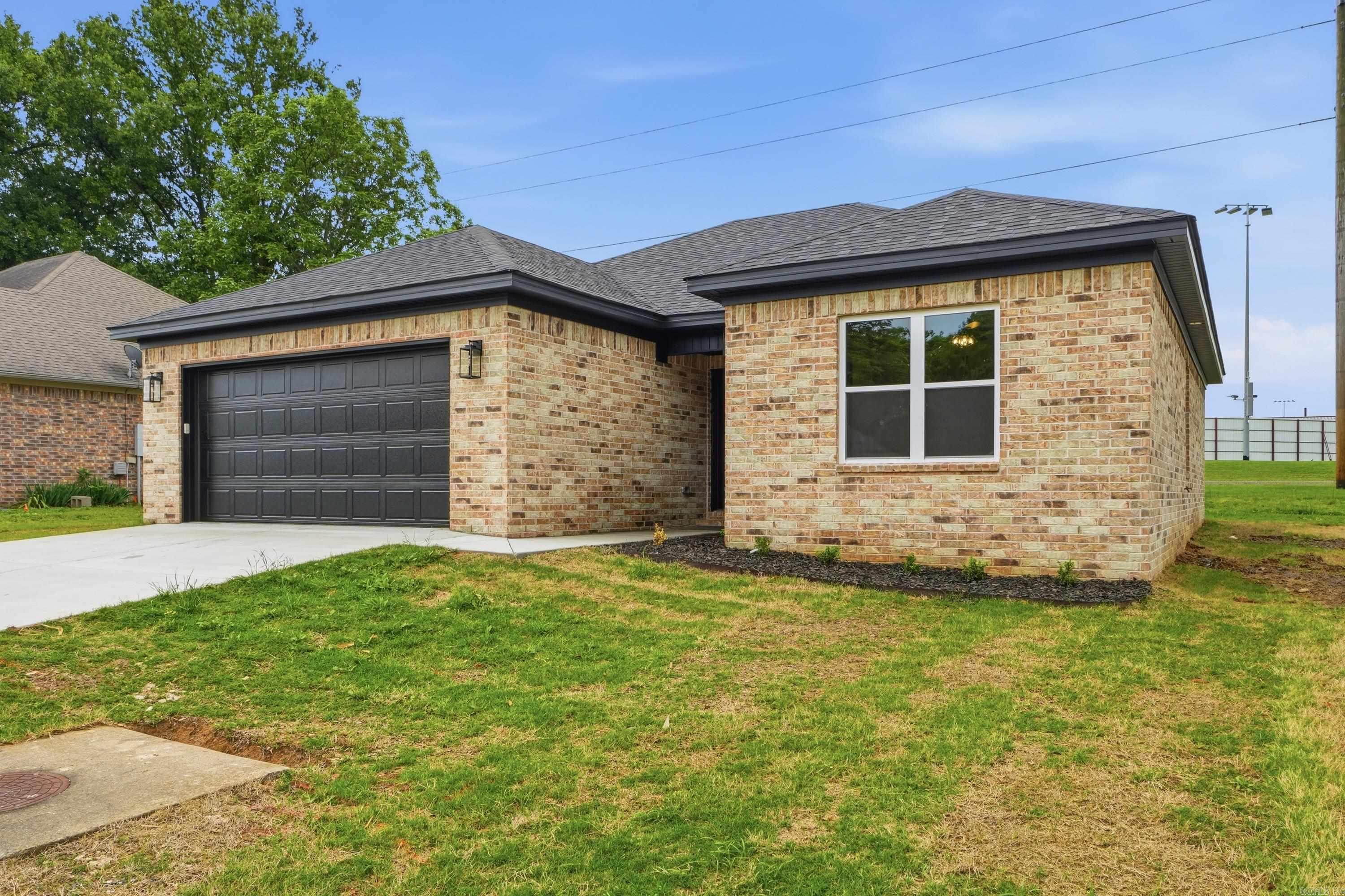 You will absolutely love this floor plan. No wasted space, living room in the back with views out the windows to a tree line between you and the neighbor. The kitchen is open to the dining area and living room. Granite countertops in the kitchen along with a beautiful island. There is a dedicated pantry as well! Tray ceiling in the living room. The primary suite is bright and airy with windows that let in tons of natural light. Large walk-in closet in primary bedroom. Split floor plan with other bedrooms apart from primary. 3 bed/2 bath brick home with 2 car garage tucked away in the Parkway Estates Subdivision in Morrilton. This is a great location. You can be at schools, shopping, and restaurants within 5 minutes. UACCM is growing, and it's just right down the road. Enjoy peaceful hikes at Petit Jean State Park less than 30 minutes away. Contact your lender to see if you qualify for a $0 down payment loan on this home! Some photos are virtually staged. Taxes are based on vacant lot assessment.  Taxes will be higher, but exact amount is unknown.