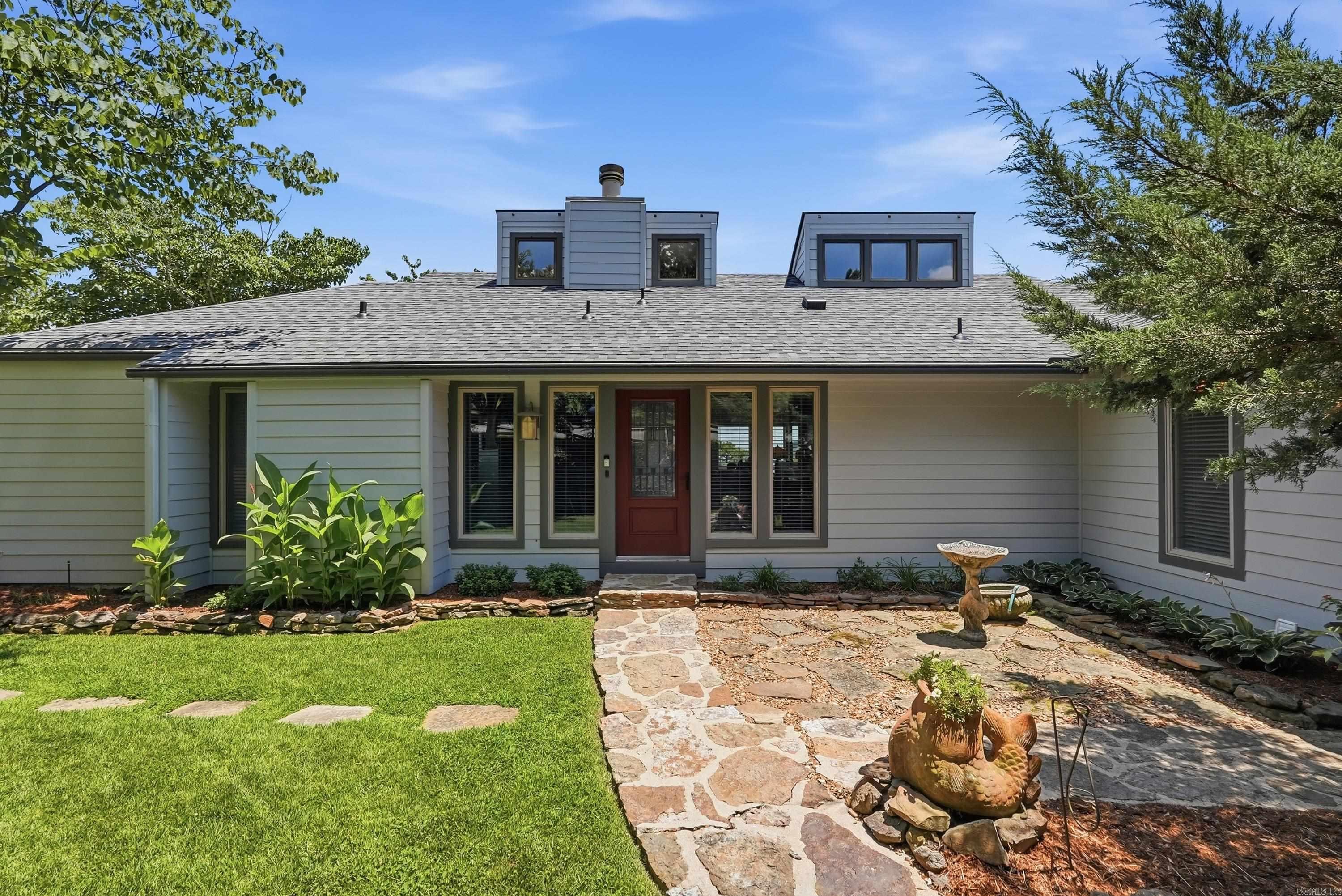 The epitome of luxury lakefront living on Greers Ferry Lake with breathtaking views is waiting for you in this fully remodeled masterpiece. You enter through a charming courtyard and step inside to a living room offering panoramic views, Italian tile, architectural trim throughout, & upscale details all opening to an expansive deck featuring luxe outdoor living. Entertainment flows seamlessly from the gourmet kitchen boasting granite counters, custom tile backsplash, wall oven, Sub Zero refrigerator & induction cooktop with warmers-to a convenient wet bar & a formal dining room with tray ceiling & masterful detail. The split-plan main floor features a vast primary retreat anchoring a sitting area with a fireplace, office nook, jetted tub, tile shower, a massive walk-in closet & a lovely courtyard. An ensuite guest bedroom completes this level. The second level hosts an entertainment zone with custom bar, rich built-ins, fireplace, primo lighting, oversized sauna, exercise space, deck access & a full bath. The lower-level functions as a flexible bedroom or game room, with a half bath, opening outside to a pristine pool with custom stonework, shower & sweeping views of the lake.