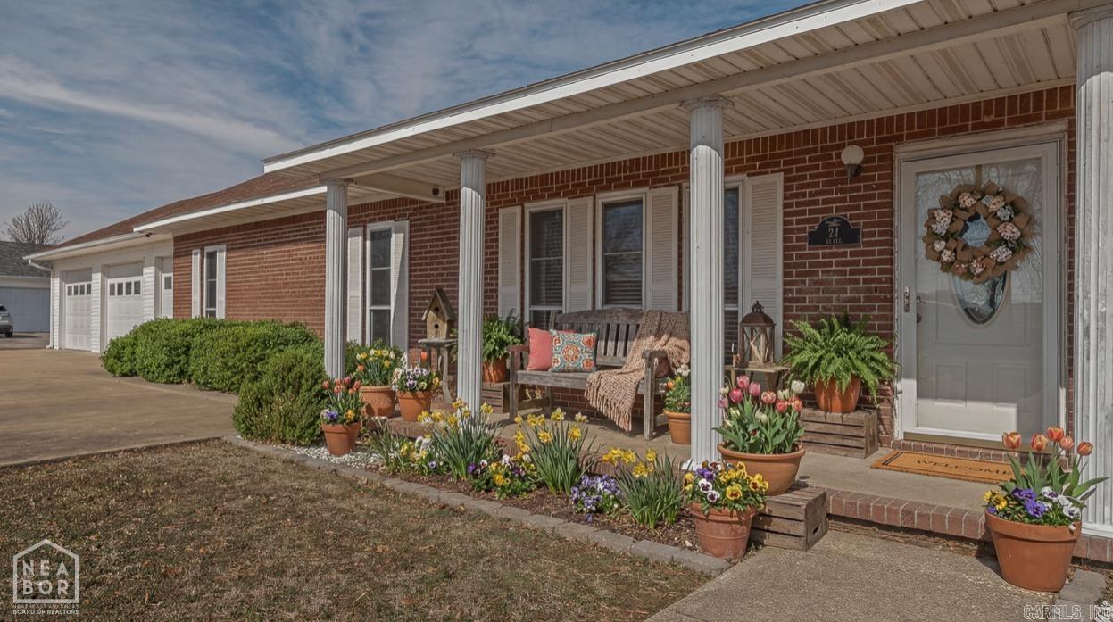 Meticulously cared for home with updates and a long list of amenities sitting within a friendly, small town community. If you want to live where people know your name and Friday Night Football is the talk of the town, you need to consider Corning, Arkansas. When you purchase 24 CR 1411 you will find yourself in one of the more cared for friendly neighborhoods right on the outskirts of town. Once inside you'll instantly fall in love with the BEAUTIFUL walnut stained custom wainscotting in the main living areas which includes the large living room that flows to the open dining area and down the hallway. The kitchen has been updated recently with an abundance of gorgeous wood cabinets and upgraded stainless appliances. Sooo much storage in the laundry room with multiple cabinets and closets, washer and dryer could possibly remain with an acceptable offer. Plenty of room to stretch out with a 2nd living area with windows all around and an outside entrance. This home has had lots of upgrades in recent years, including a new roof in 2025, new HVAC in 2019, a new 60 gallon water heater in 2017. New LVP flooring was installed in February 2026 and the entire interior was repainted
