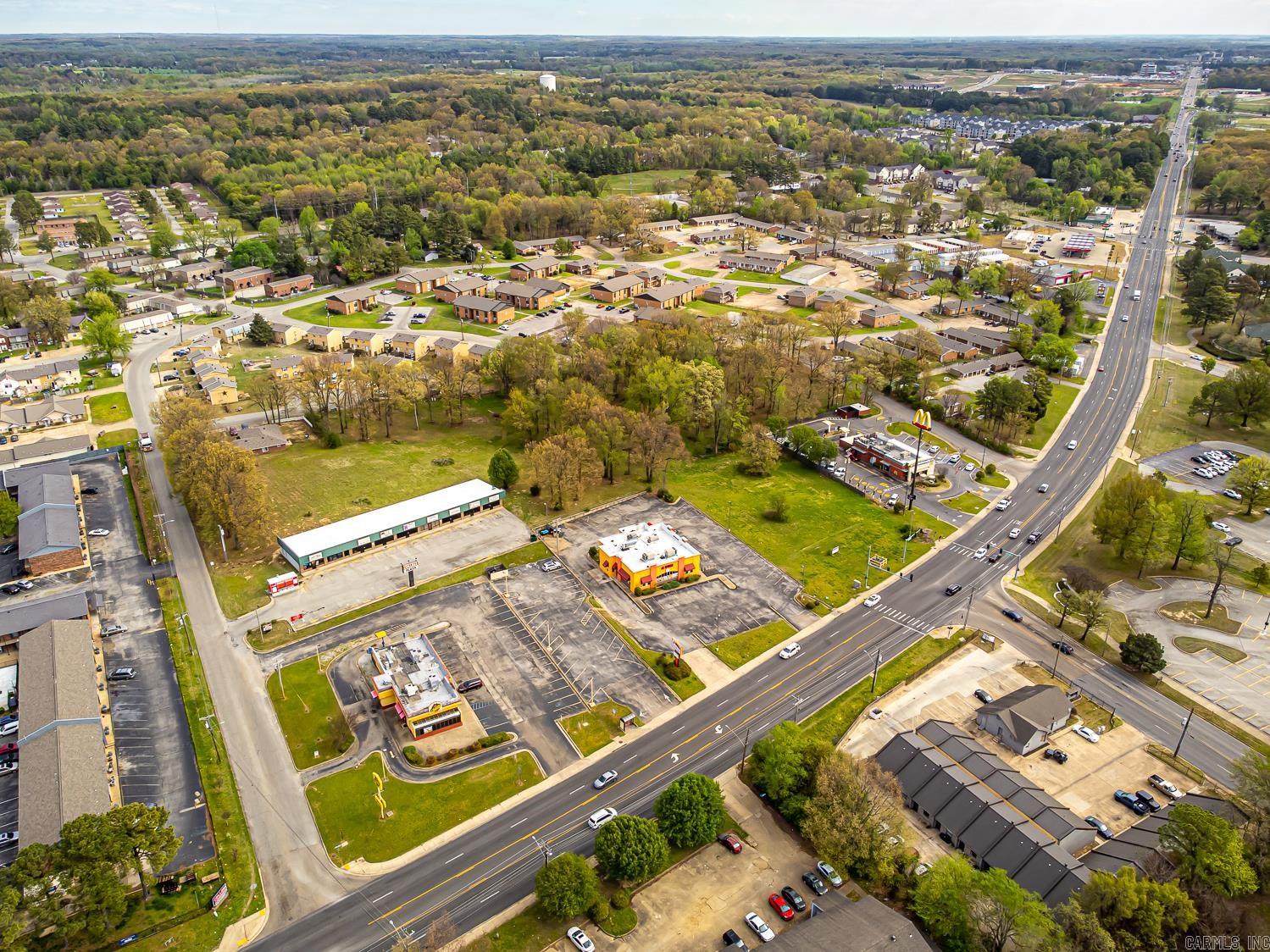 Welcome to Market 3.67 +/- Acres on Melrose Street and Russell Drive in Jonesboro, Arkansas. Golden Opportunity Knocks. Commercial Property zoned C-3 situated on 3.67 +/- acres with a 7 Unit Retail Strip Center and .65 +/- acre lot available to purchase separately. Located across the street from Arkansas State University and near Northeast Arkansas Baptist Memorial Hospital, Jonesboro Municipal Airport, and favorite local retail & dining establishments. Property runs block to block and has two access points/potential driveways/entry points.  Estimated daily traffic counts of 20,000.  Offerings such as this are few and far between. Call today to schedule your tour and make an investment in tomorrow.