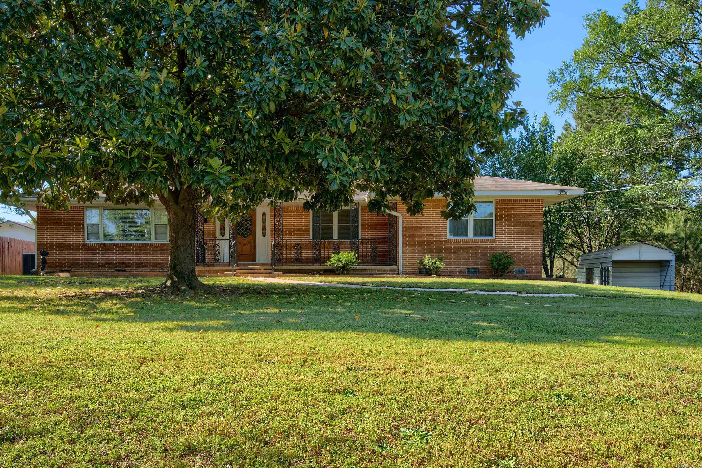 Roomy Mid Century Modern with all the right things! Marble faced fireplace in formal living room, original front door, artistic blocks in garage and winding planter beds frame the back patio! Large rooms with formal dining room, large office that could be a 3rd bedroom (frame in a door). Bright & cheery updated kitchen with loads of cabinets & natural light. Private back yard space with plenty of room for family fun, gardening and pets. Huge carport for your boat in addition to the side loader garage! You will not run out of parking for your guest with the wide level driveway. This home has many desirable features inside and out & in a well know, desirable & established location. The Greenway trail is at the end of the road for an added bonus for any nature lover seeking to enjoy our beautiful city. Front to the right of the home is an old well for outdoor use, owner never used.