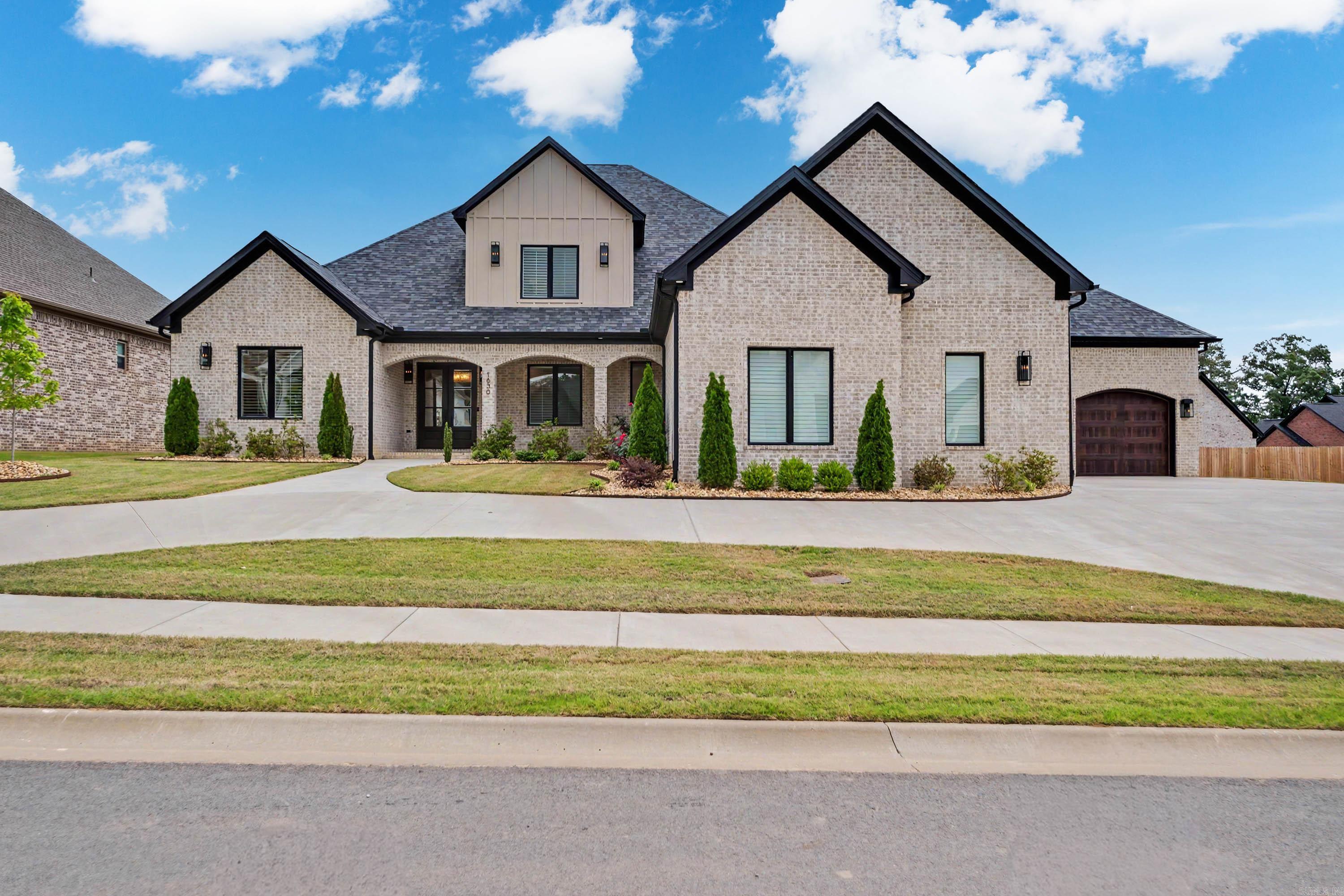 Welcome to 1630 Dolphin Drive - an exceptional custom-built luxury home in Conway's premier Land's End community. Spanning over 4,000 sq/ft, this thoughtfully designed residence offers 4-bedrooms, 4.5-baths, a private office, bonus/media room, and a 4-car garage. The stunning great room features soaring ceilings, a dramatic floor-to-ceiling fireplace, and a designer chandelier creating an unforgettable focal point.   A light-filled sunroom with built-in prep space, sink and cabinetry offers the flexibility of a second-kitchen or entertaining area. High-end finishes include custom cabinetry, quartz countertops, designer tile, and intricate trim work throughout.   The open concept layout features a hidden walk-in pantry and motorized window treatments for effortless comfort. Lower-level bedrooms include private en-suite baths and walk-in closets.   The primary suite offers a spa-like bath with a soaking tub, oversized shower with dual heads and bench and a massive walk-in closet tucked behind a pocket door.  An upstairs media room is pre-wired for surround sound and is ready for movie nights.   Situated in a sought-after golf course community, this nearly new home is move-in ready!