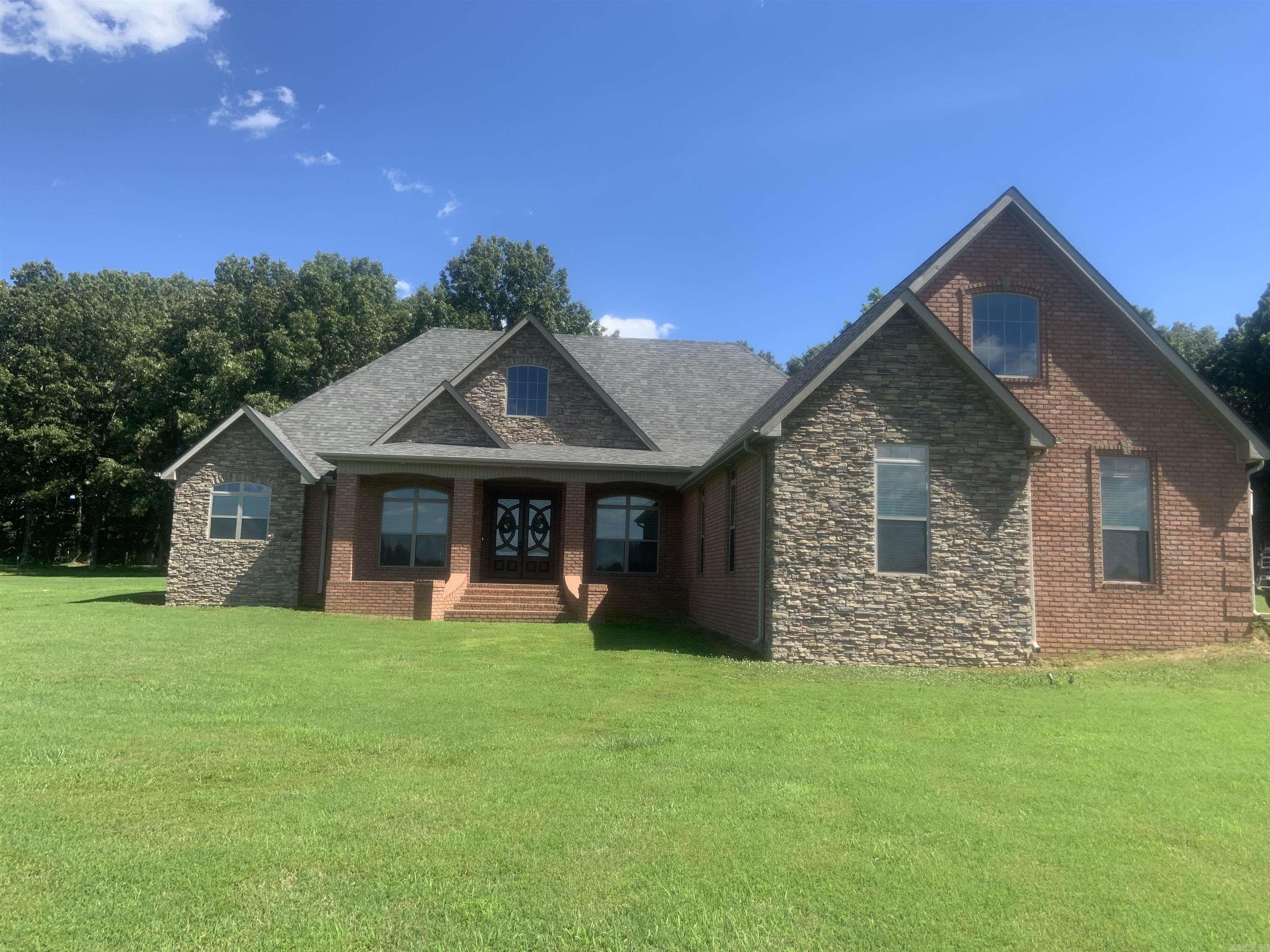 Brick/Vinyl, 3br, 2.5 ba. LR w/wood burning insert,  Kit. w/Birch cabinets w/formica counters, breakfast bar & breakfast room. Sun Room off hall, could be a bedroom.  Nice screened-in porch off breakfast room. Lg. Primary BR with two walk-in closets, Primary bath w/linen closet, two separate vanities, whirlpool tub & sep. shower.   Walk out basement w/large room and bedroom area and half  bath.  All neutral colors, flooring is carpet and vinyl, This listing consist of two houses, 30 x 40 barn, sm, animal shed metal carport, 20 acres w.small pond.  See MLS #24020445