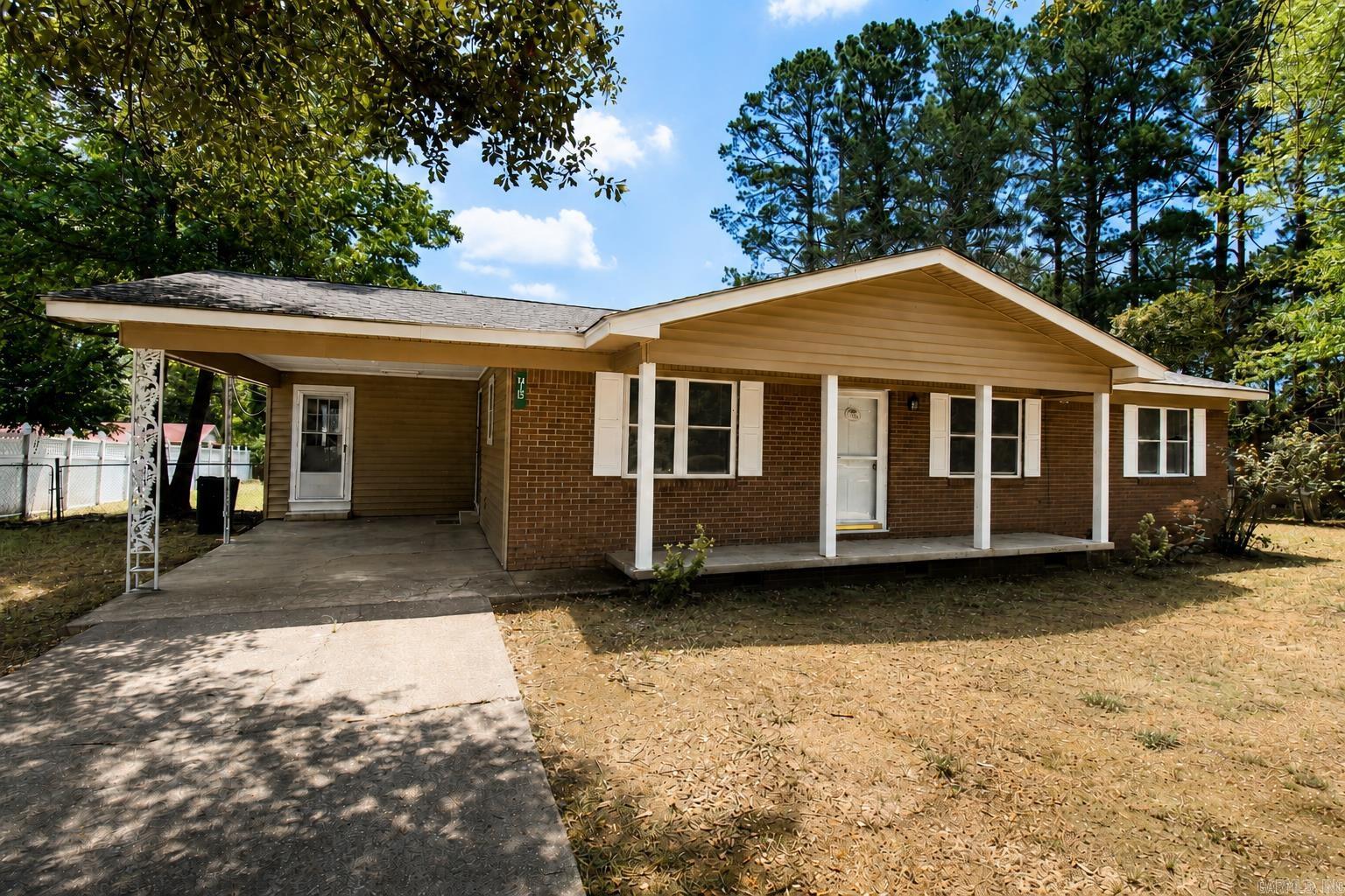 Need Room to Spread Out? This Home Has It!  Enjoy two separate living areas with a welcoming front living room and a huge back den, plus a large dining area that's perfect for family meals and a huge built in cabinetry ensemble. The back den also has a fireplace for gas logs only.  Major updates include a 3-year-old roof, 7-year-old HVAC system, newer windows, and no carpet anywhere—just beautiful hardwood floors, tile, and new luxury vinyl plank flooring for easy maintenance. Freshly painted, new counter tops, new light fixtures and new plumbing fixtures.  The kitchen comes fully equipped with all appliances, including a brand-new refrigerator and dishwasher and new counter tops!  Step outside to a huge-covered patio overlooking a large, fenced backyard—ideal for cookouts, gatherings, pets, or play. Also, a newer storage building for all your tools and outdoor equipment.  Located on a quiet street within walking distance of the Recreation Center. Don't miss your chance to make it yours! Some pictures are AI generated.