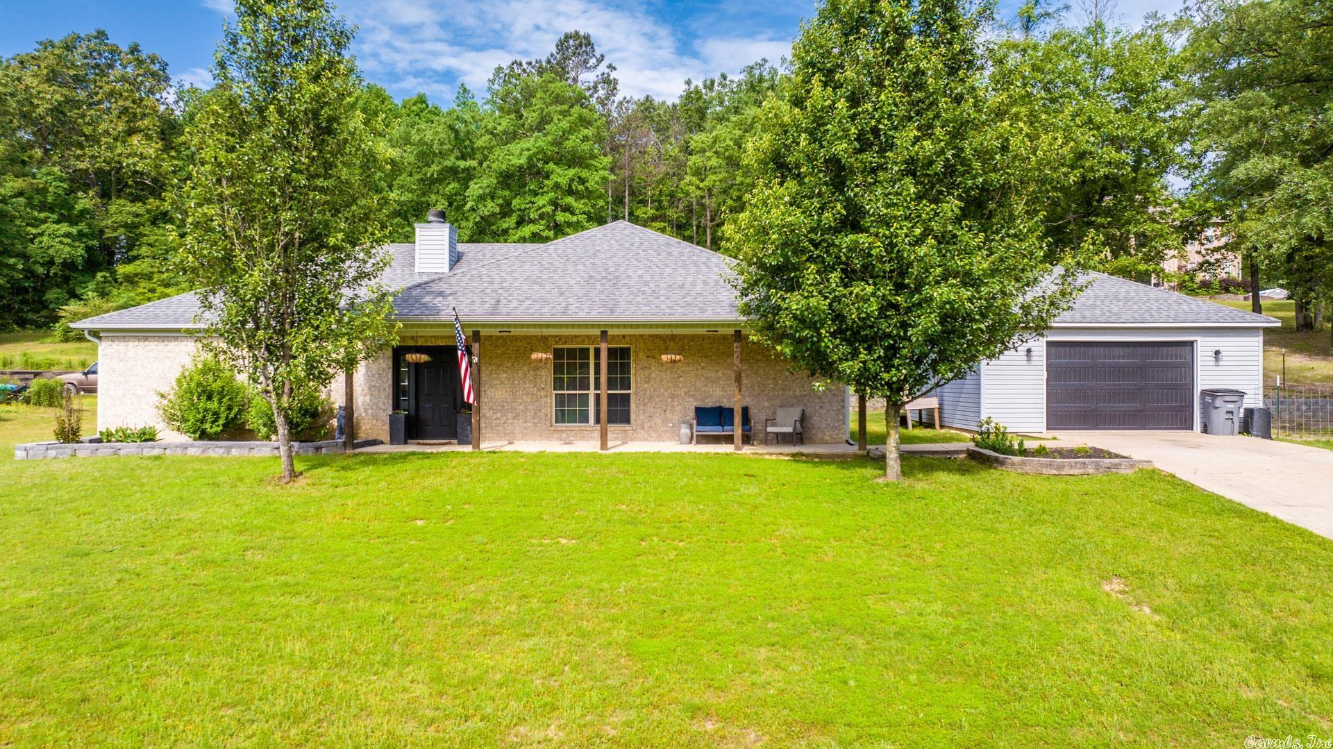 This beautiful home is sitting on 1 acre in a quiet cul-de-sac!  Enjoy a country setting but close enough to town.  Enter into a foyer that opens up to a large living room that features a beautiful wood burning fireplace.  The dining room and kitchen  is large and great for entertaining. The kitchen features a breakfast bar and beautiful painted cabinets.  Large window in dining room with lots of natural light and overlooks a cozy covered back patio.  This great home has so many features and updates: new paint, new vinyl smart core floors, tile in wet areas, new light fixtures, walk in closets, new back door, roof 5 years old, new insulated garage door. NEW HVAC!  Schedule your showing!