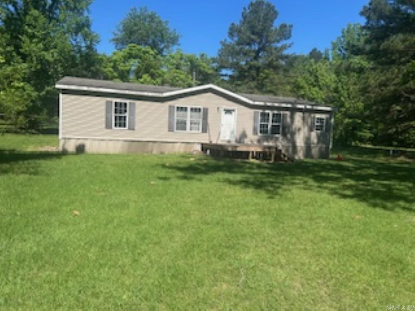 Discover your perfect retreat with this beautiful, private 5-acre property! This nicely updated 3-bedroom, 2-bath mobile home offers 1,568 square feet of comfortable living space. Ideally situated between El Dorado and Camden, you’ll enjoy quick commutes to work, shopping, or town amenities. Don’t miss your chance to own this peaceful slice of paradise—schedule your visit today!