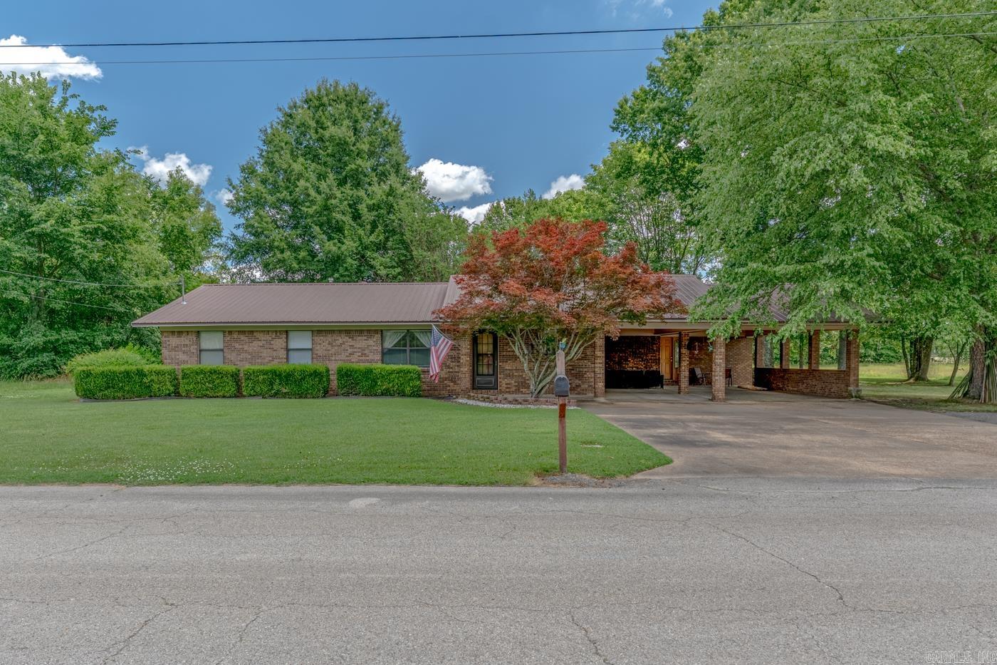 Welcome to Market 111 Royale Dr. in Jonesboro, AR within the Westside School District. Situated on .31 +/- acres is a well-maintained ranch style home offering 2,588 sf of living space and a rare layout with 2 living spaces under 1 roof. Wrapped in brick & vinyl siding, topped w/ a metal roof, and accented by a 2 car carport, patio, mature shade trees, and a detached brick storage building. The interior holds 6 bedrooms, 3 full baths, and 1 half bath across 2 connected living spaces. The front residence offers 1,630 +/- sf and includes 4 bedrooms, 2.5 baths, spacious living area, custom kitchen w/ abundant cabinetry, built-in wall oven, cooktop, eat-in dining, walk-in closet(s), and laminate, carpet, and vinyl flooring. Attached is a 960 +/- sf secondary living area featuring 2 bedrooms, 1 bath, full kitchen, laundry area, separate water heater, and exterior access. Whether you need extended living space, guest accommodations, or a property with options, this one is worth seeing. Conveniently located near E Johnson Ave, Joe Mack Campbell Park, and favorite local amenities. Call today to schedule your tour and make this house your home or next addition to your investment portfolio.