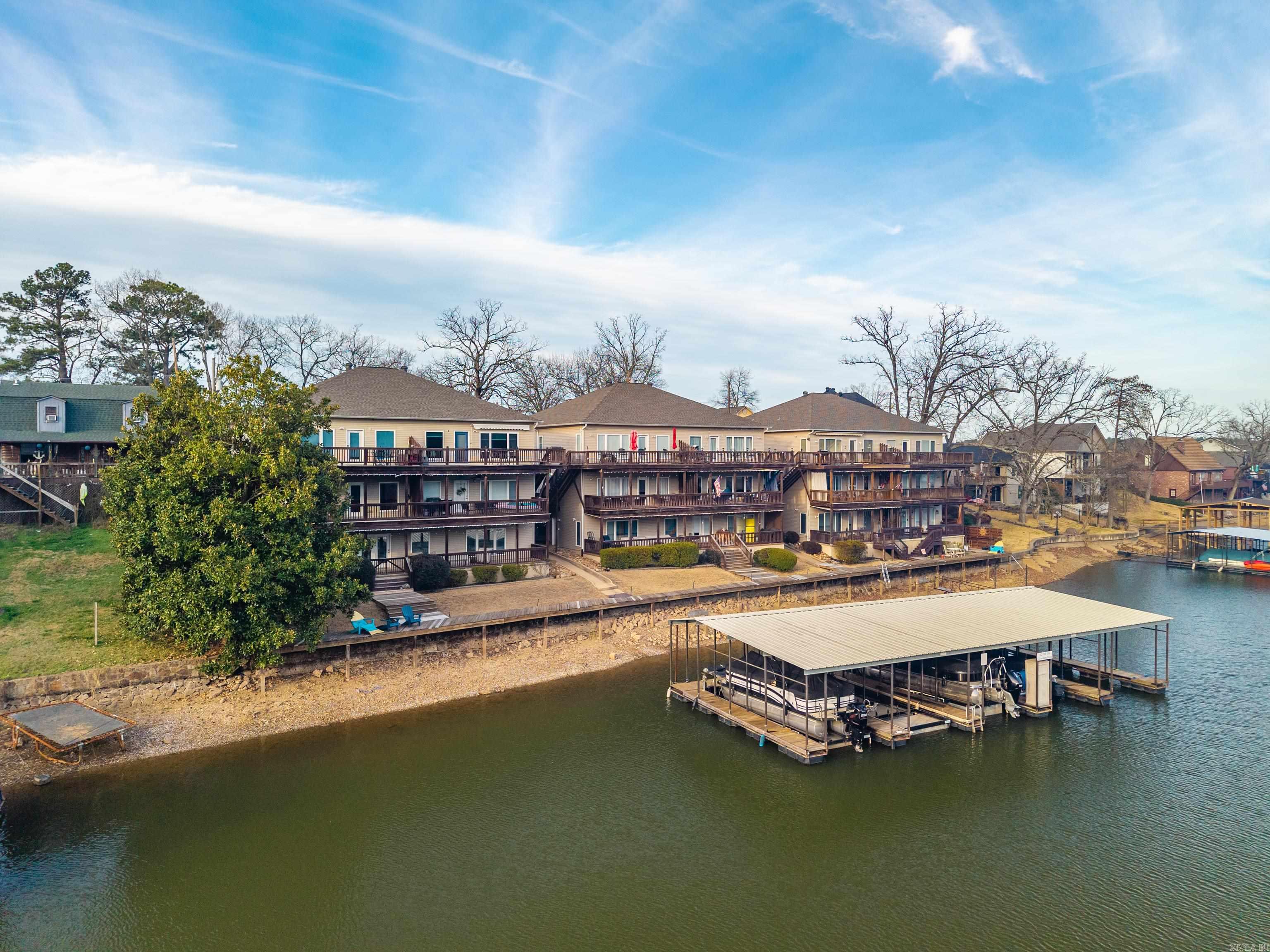 Lakefront Living on Beautiful Lake Hamilton – Fully Furnished 3BR/2BA Condo  Wake up to stunning water views and unwind each evening on your deck overlooking Lake Hamilton. This beautifully maintained 3-bedroom, 2-bath condo offers the perfect blend of comfort, style, and location.  Property Highlights:  Fully furnished – move-in ready  Lakefront deck  Boardwalk and swim dock for temporary boat tie up.  Spacious 3 bedrooms & 2 full bathrooms  Numerous updates throughout  Brand-new kitchen appliances  Open-concept living and dining area ideal for entertaining  Centrally located with convenient access to shopping, dining, and entertainment  Enjoy peaceful mornings by the water and relaxing evenings with sunset views — all from the comfort of your own deck.  Rental Policy: No short-term rentals permitted. Minimum rental period is 30 days or longer, making this an ideal full-time residence, second home, or long-term investment opportunity.  This is lakefront living at its finest — schedule your private showing today!