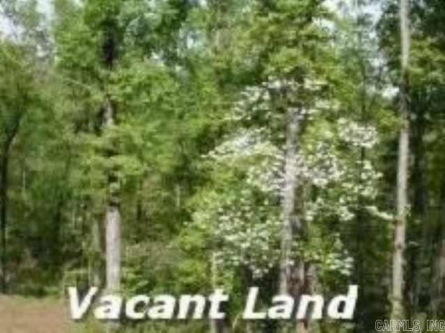 Flat level 3 acre lot located in a gated community. Septic system already planned. Use our builder or your own.