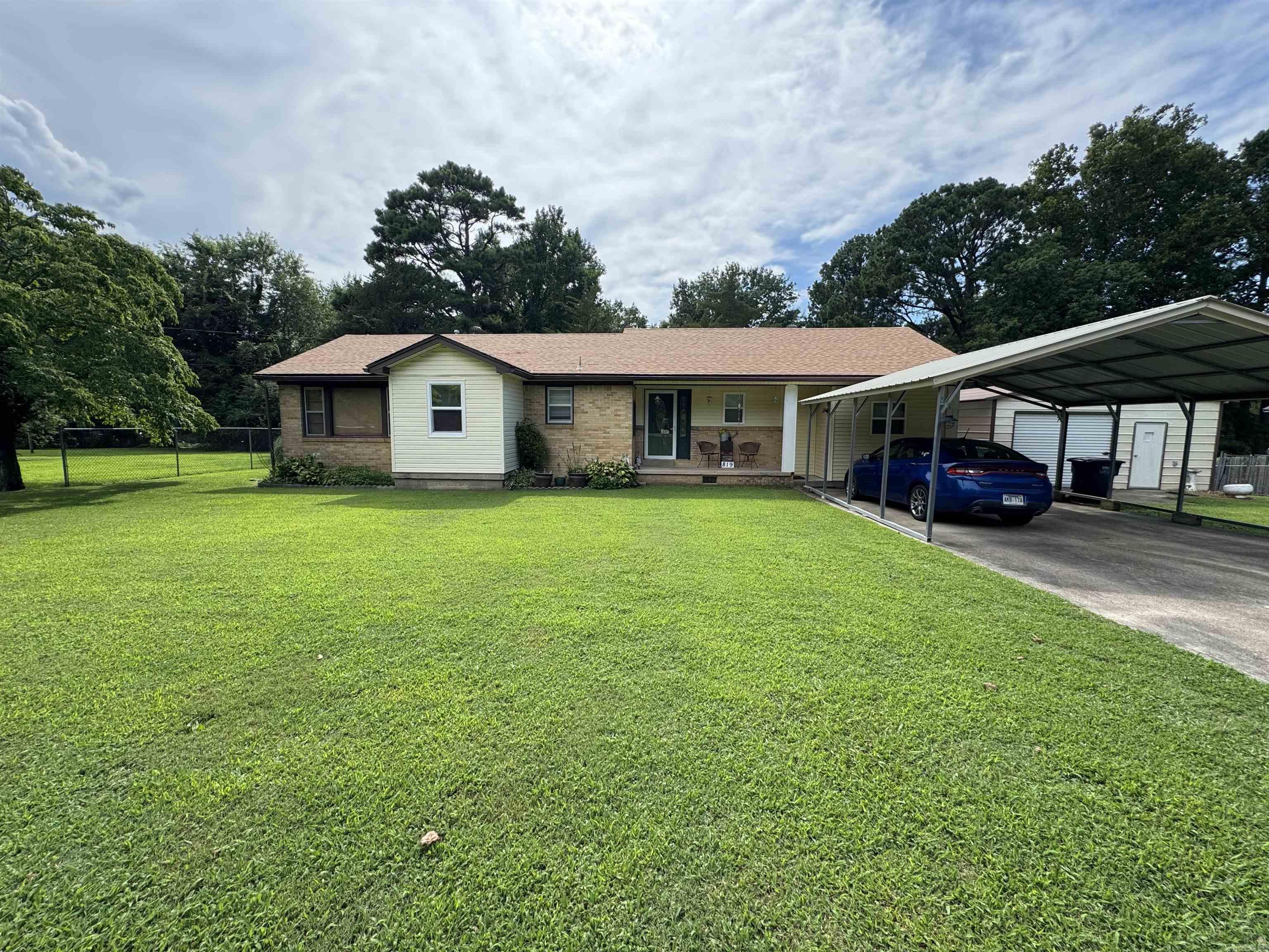 Welcome to 819 S. 12th Ave., Piggott, AR! This inviting 3-bedroom, 2-bathroom home offers 1,549 square feet of comfortable living space and sits on a generous 0.47-acre lot, providing plenty of room to enjoy both indoor and outdoor living.  Step inside to find a functional floor plan with spacious living areas, comfortable bedrooms, and a warm, welcoming atmosphere that’s perfect for everyday living or entertaining guests. Outside, the oversized yard offers endless possibilities for gardening, play, pets, or creating your own outdoor oasis.  Conveniently located close to schools, shopping, and local amenities, this property combines small-town charm with the space you’ve been looking for. Whether you’re a first-time buyer or searching for your forever home, this one is ready to welcome you.  Don’t miss your chance to own this wonderful Piggott property—schedule your private showing today