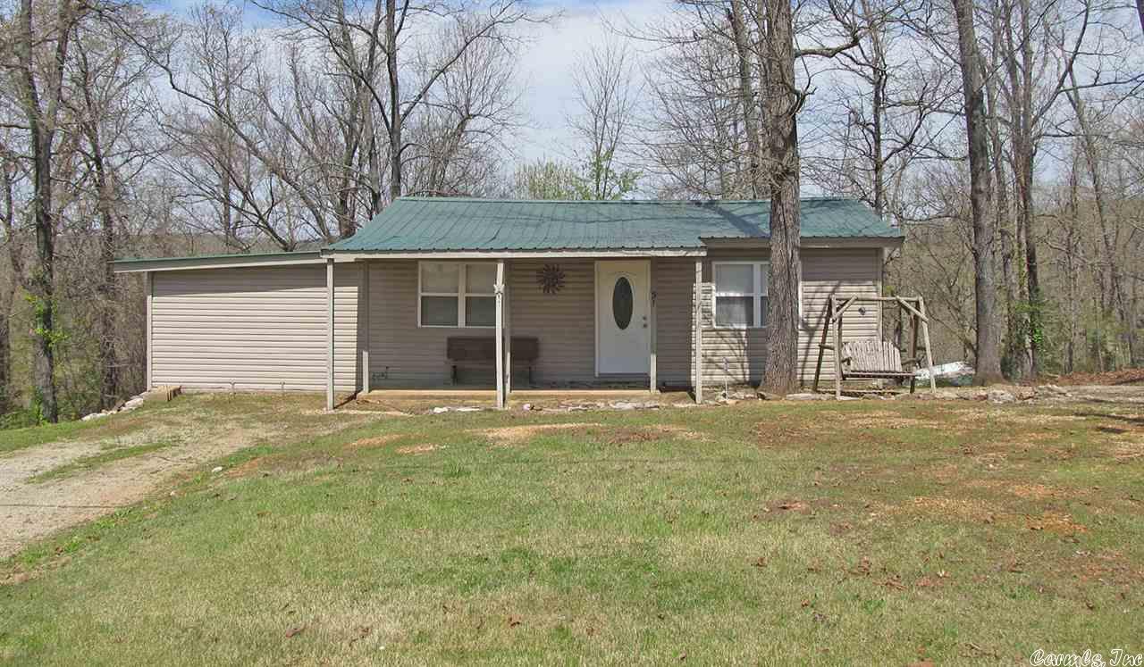 Perfect Get Away Home - This home has a cabin feel with laminate wood flooring and wood interior walls. Offers 2 bedrooms, full bath, living room and kitchen. You can walk to Lake Sequoyah or just relax and enjoy the peacefulness of Cherokee Village.