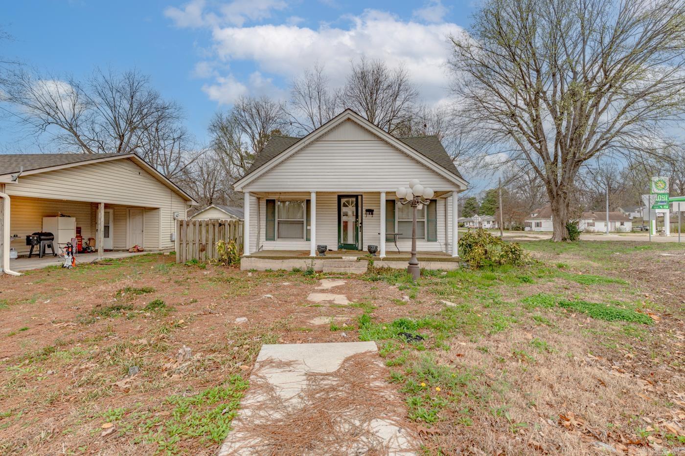 Welcome to the market 611 W Jackson St, a corner-lot property located in the heart of Piggott, Arkansas. This parcel offers a valuable opportunity for buyers seeking an affordable, utility-ready site with excellent potential for redevelopment. Approximately 0.20 acres, this property sits on a 125 ft × 70 ft lot—providing ample room for a new build, investment structure, or future expansion. All major utilities are already on site, including water, electric, and gas, making this a convenient and cost-efficient starting point for your next project. The existing structure on the property has been condemned by the city, and the true value lies in the land itself. Buyers can take advantage of a clean slate to design and construct a residence or investment property tailored to their needs.This location places you within minutes of Piggott’s local amenities, schools, and community services. Whether you're a builder, investor, or future homeowner, 611 W Jackson St presents a rare chance to secure a utility-ready lot in an established neighborhood. Call today!