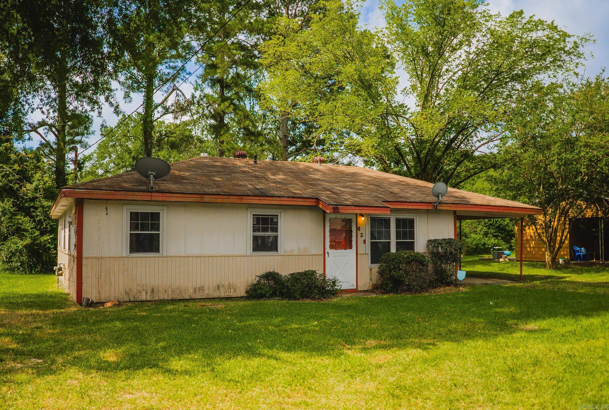 Opportunity awaits at 420 E. Oakland Ave! This approximately 1,500 sq. ft. home sits on a spacious 0.25-acre lot and offers great potential for an investor or buyer looking to make it their own. Featuring a functional layout, covered parking, and a convenient location near schools, shopping, and downtown Monticello, this property is ready for its next chapter. Priced to reflect current condition or further renovation. Buyer is encouraged to verify square footage and all property information.