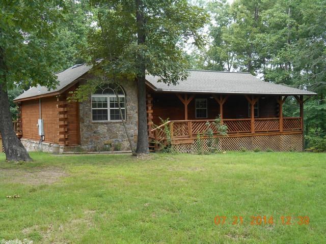This is your opportunity to own a log cabin in Mountain View, Ar.!  Dreams do come true!  This 3 bd./2 ba. log sided home offers a large front porch; and a huge deck area at the back of the home, for relaxing!  The master suite offers a private bath; and large walk-in closet.  Carport offers extra height and is suitable for some r.v.s.  The property is wooded and offers those incredible views that Mountain View is famous for! Property is a short drive from town; but offers a feel of seclusion!  Great Price!