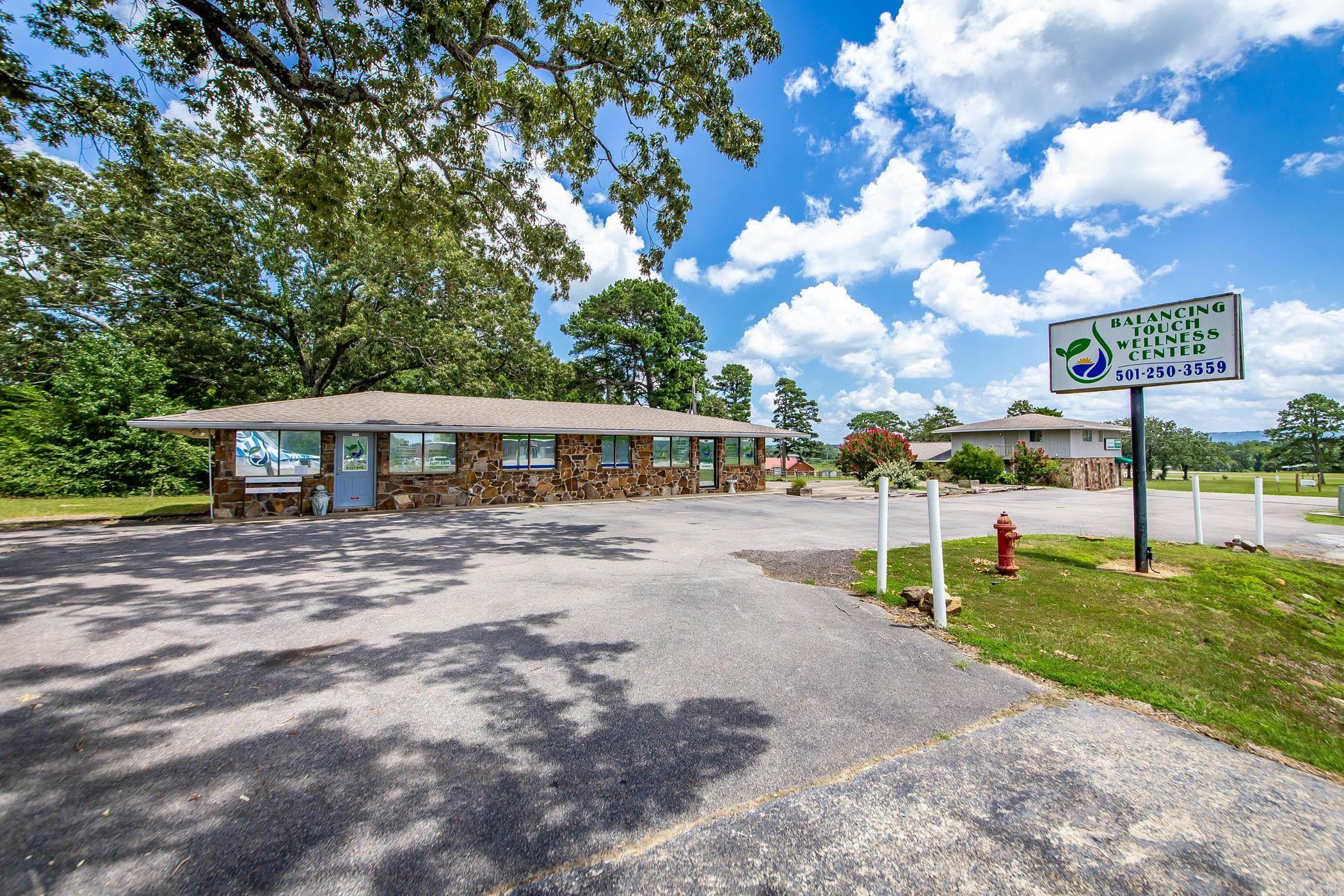 This is a great opportunity for a Business right in the "heart of Greers Ferry". This land already has an existing building with a business leasing it. The land has room for several types of businesses. It is designed to be two separate units of 1050 sq.ft. and 450 sq.ft. with two separate entrances and exits and independent HVAC systems. At one time there was a working Carwash located on the property so there is plenty of space for another one, or in the back of the land even a small RV Storage or even several Food Trucks to keep the vacationers able to have a variety of small restaurants. Lot of options and many opportunities await.  Take a tour and get started on your new business today. ( The two story Chiropractic Clinic is not included in this sale. )